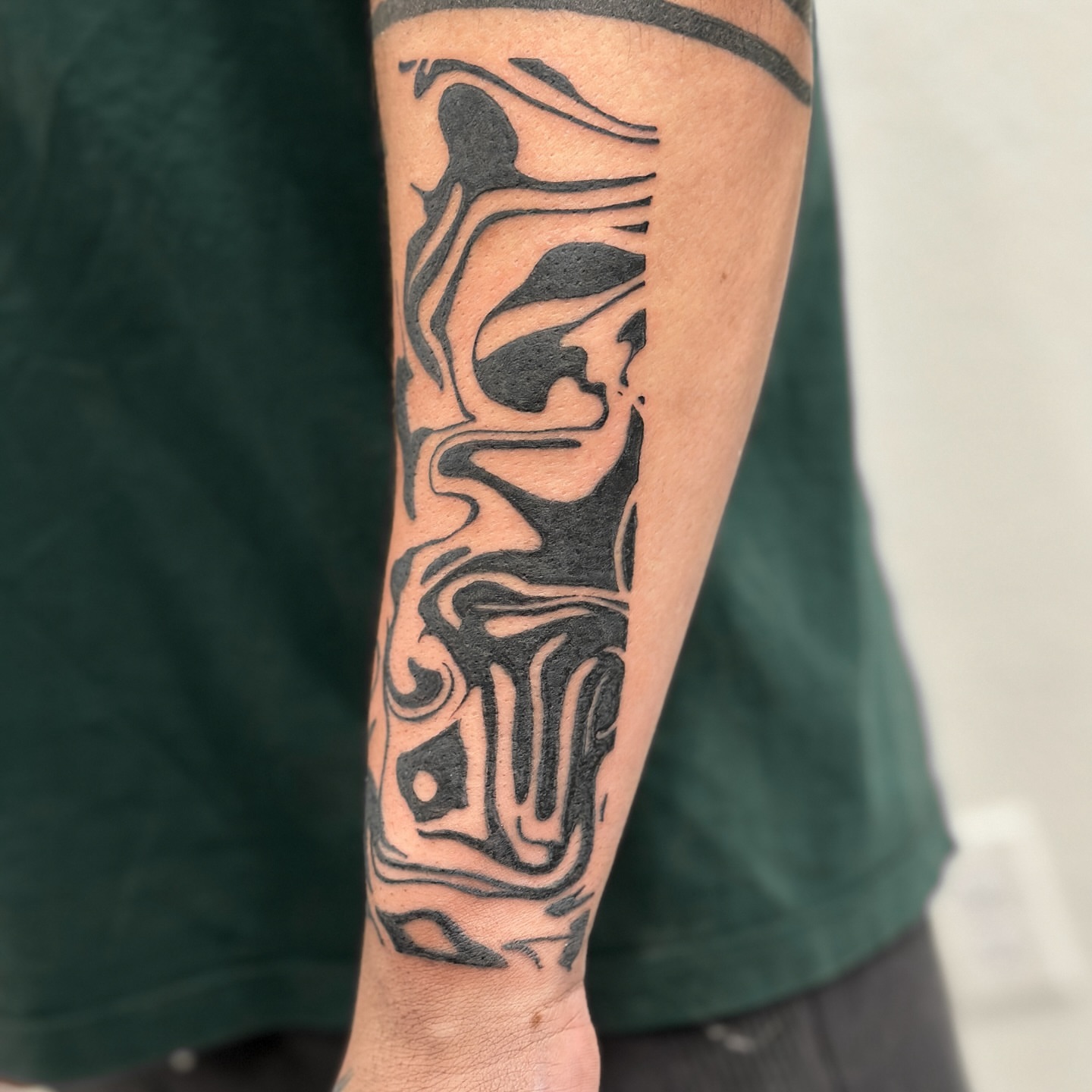 Abstract design black and grey tattoo on the forearm by Alex