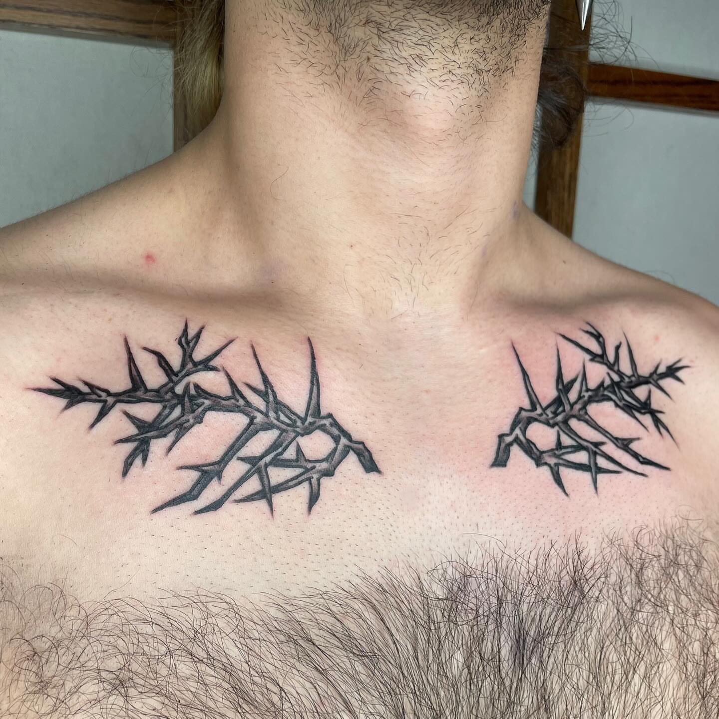 Thorn branches black and grey tattoo on the chest by G. Clover ⚧︎, Chicago, Illinois