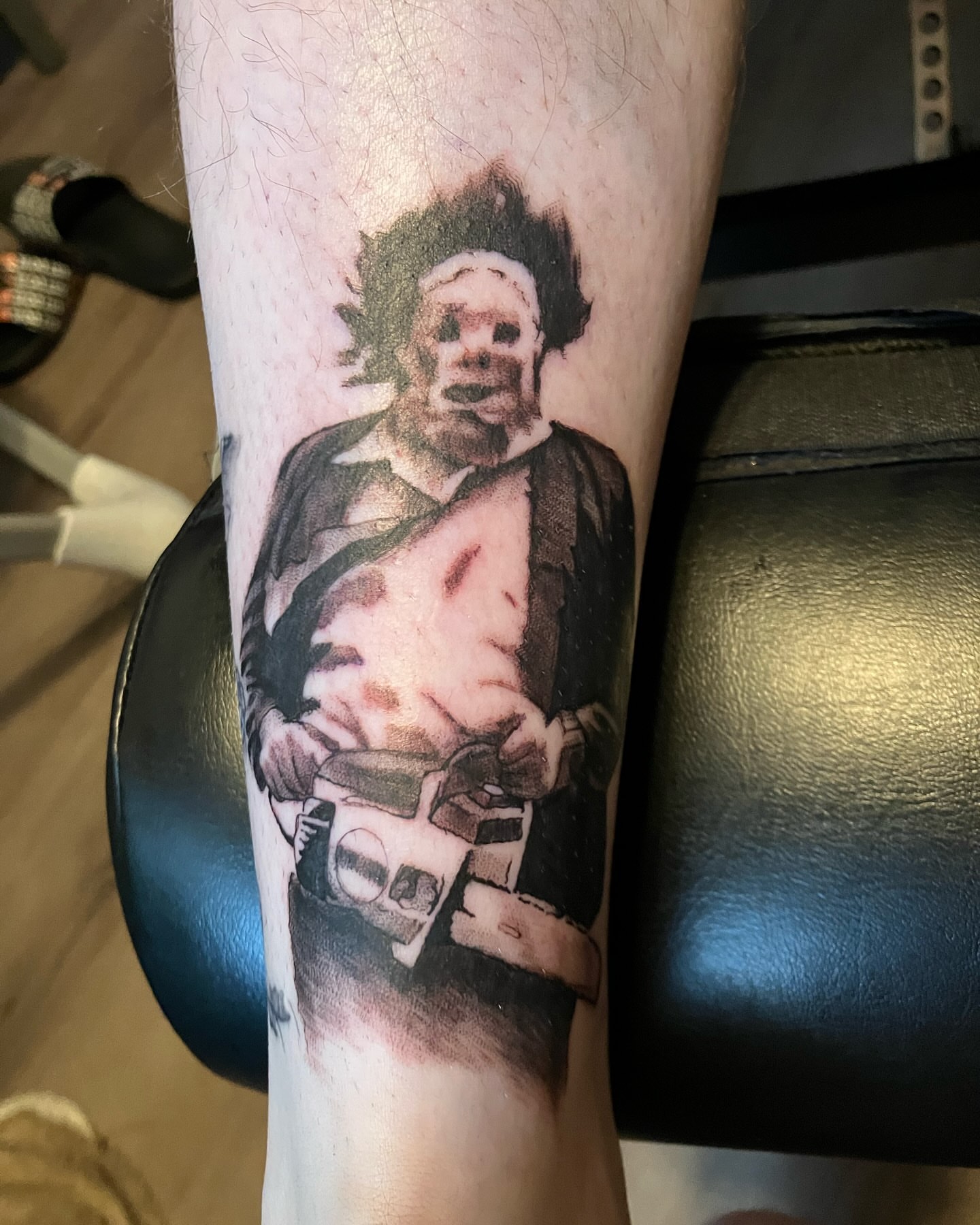 Man with gun realism tattoo on the forearm by Hot Dawg
