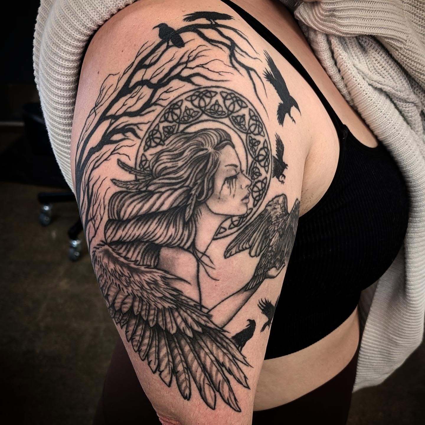 Woman with wings realism tattoo on the shoulder by Krista Mc