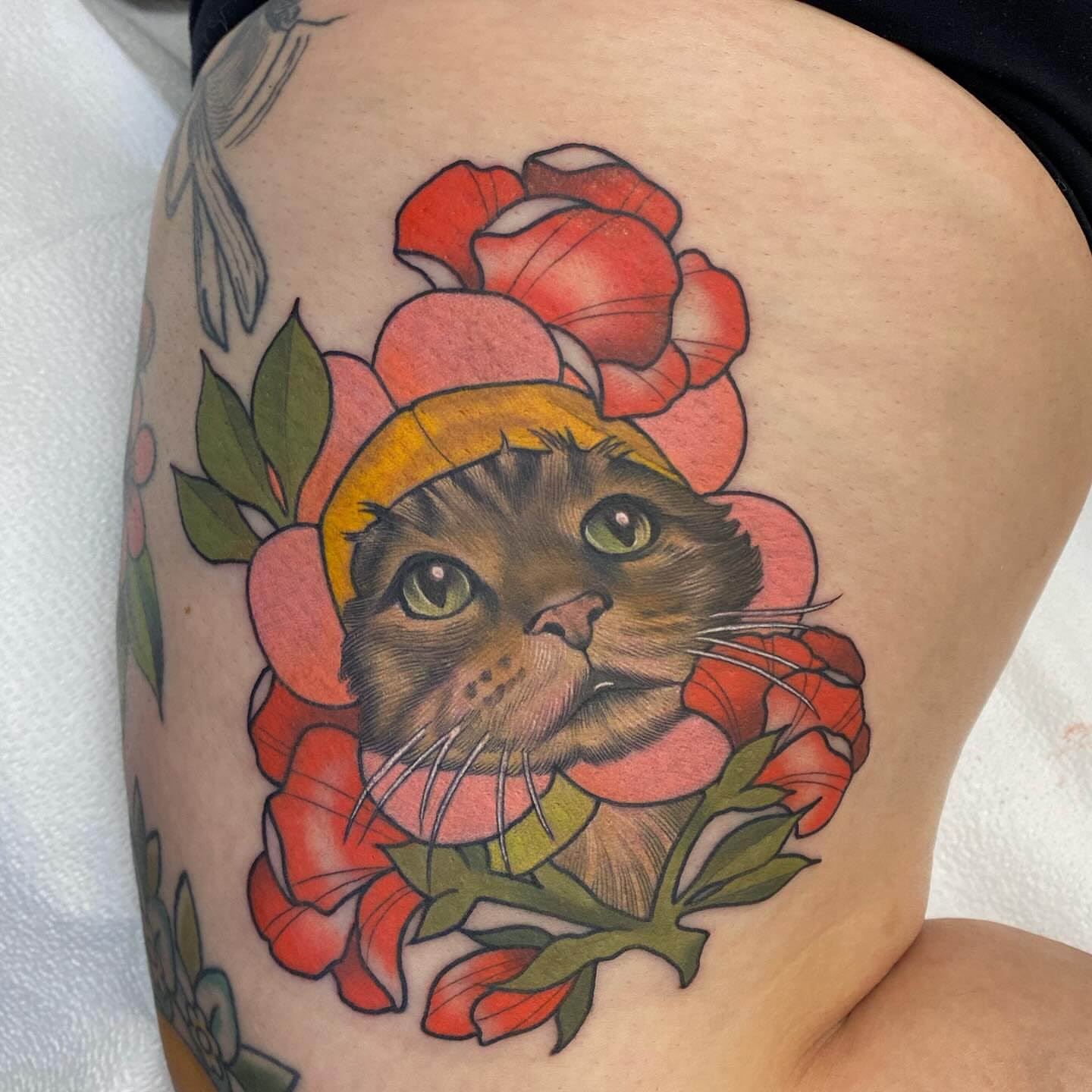 Cat and roses American traditional tattoo on the thigh by Connie Fiorino - Tattoo Artist