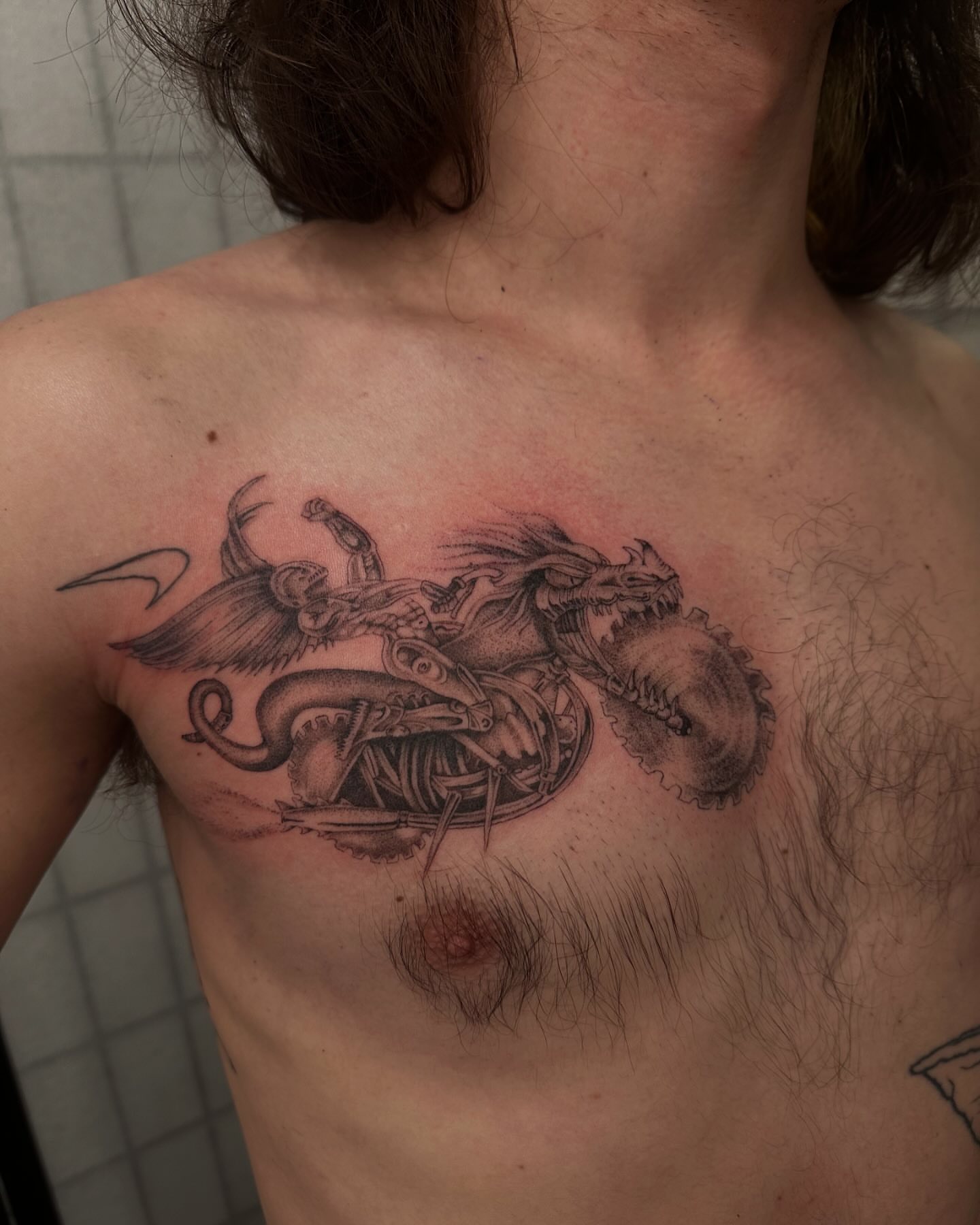 Mechanical dragon realism tattoo on the chest by 𝖍𝖆𝖓𝖓𝖆𝖍