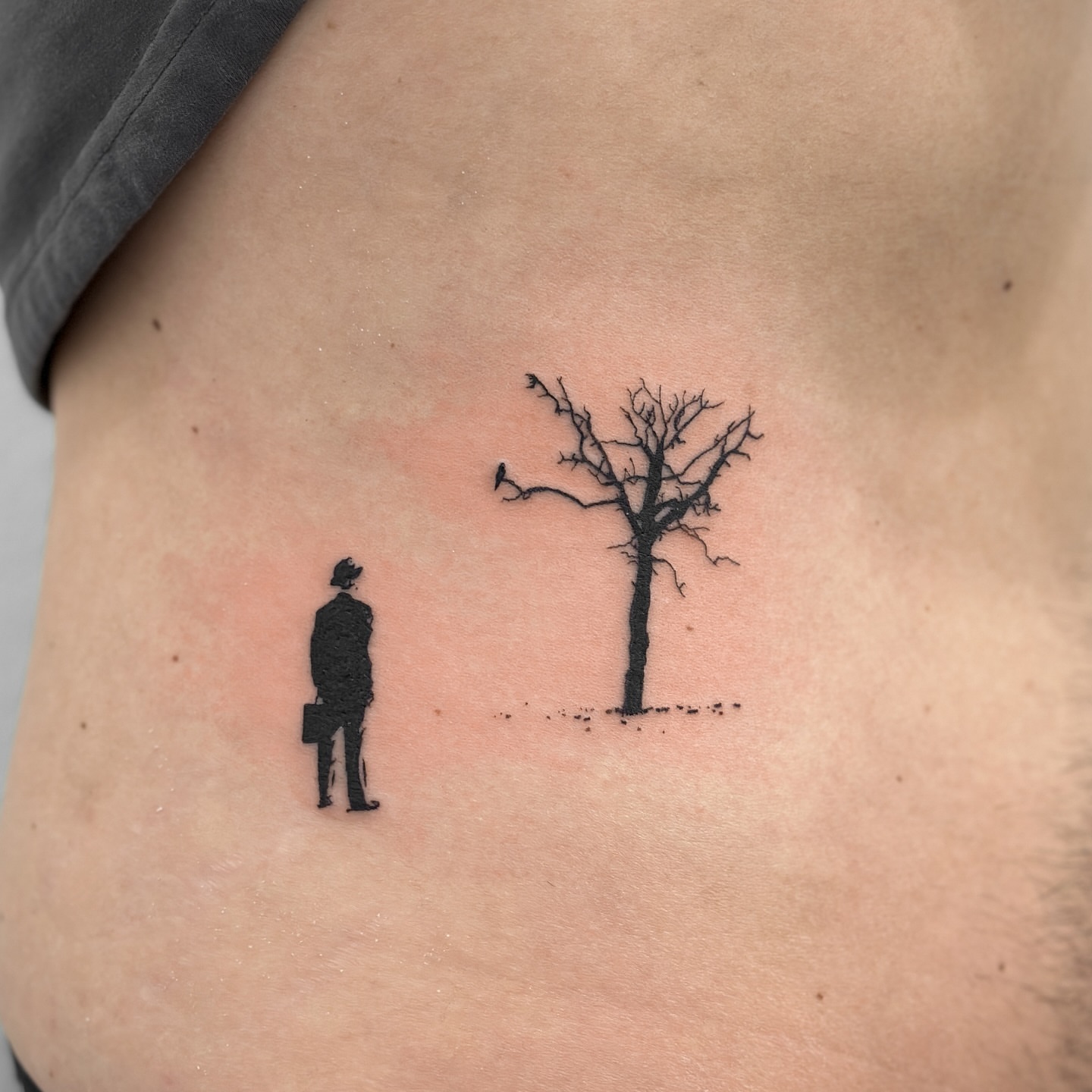 Man and tree minimalist tattoo on the torso by Alex