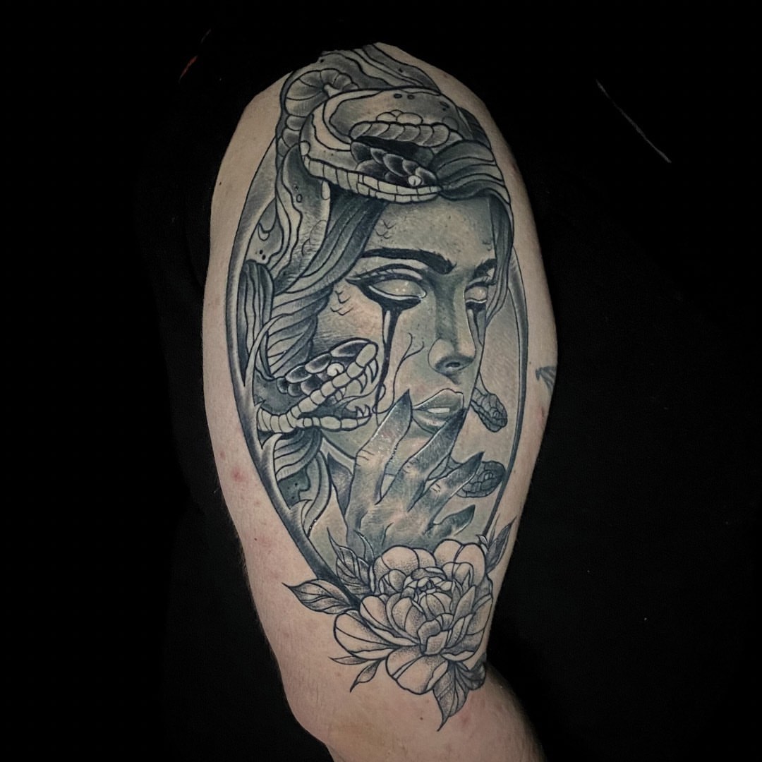 Woman with snake and peony realism tattoo on the forearm by Brian Overholt