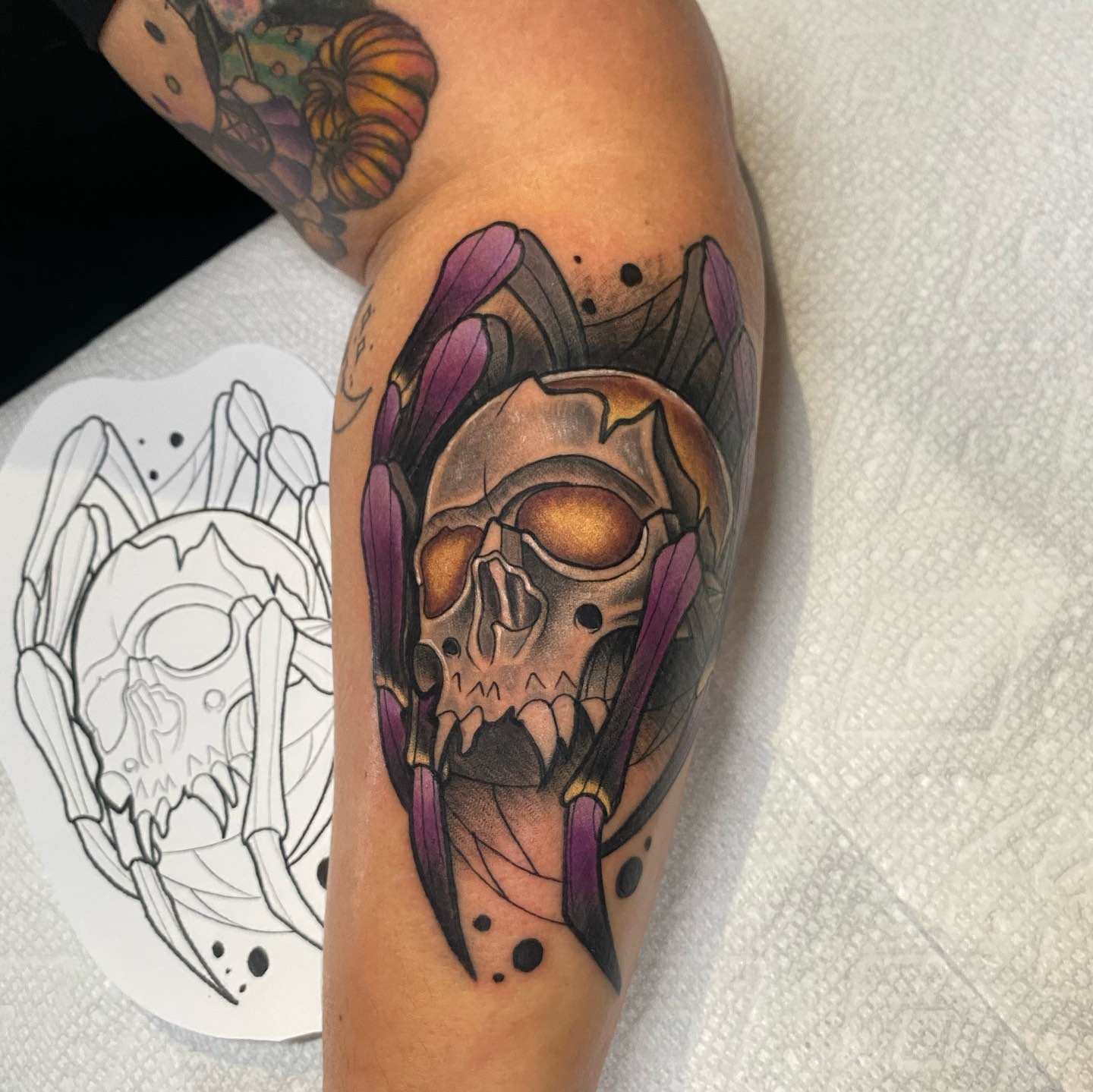 Skull with wings dark realism tattoo on the forearm by Brian Overholt