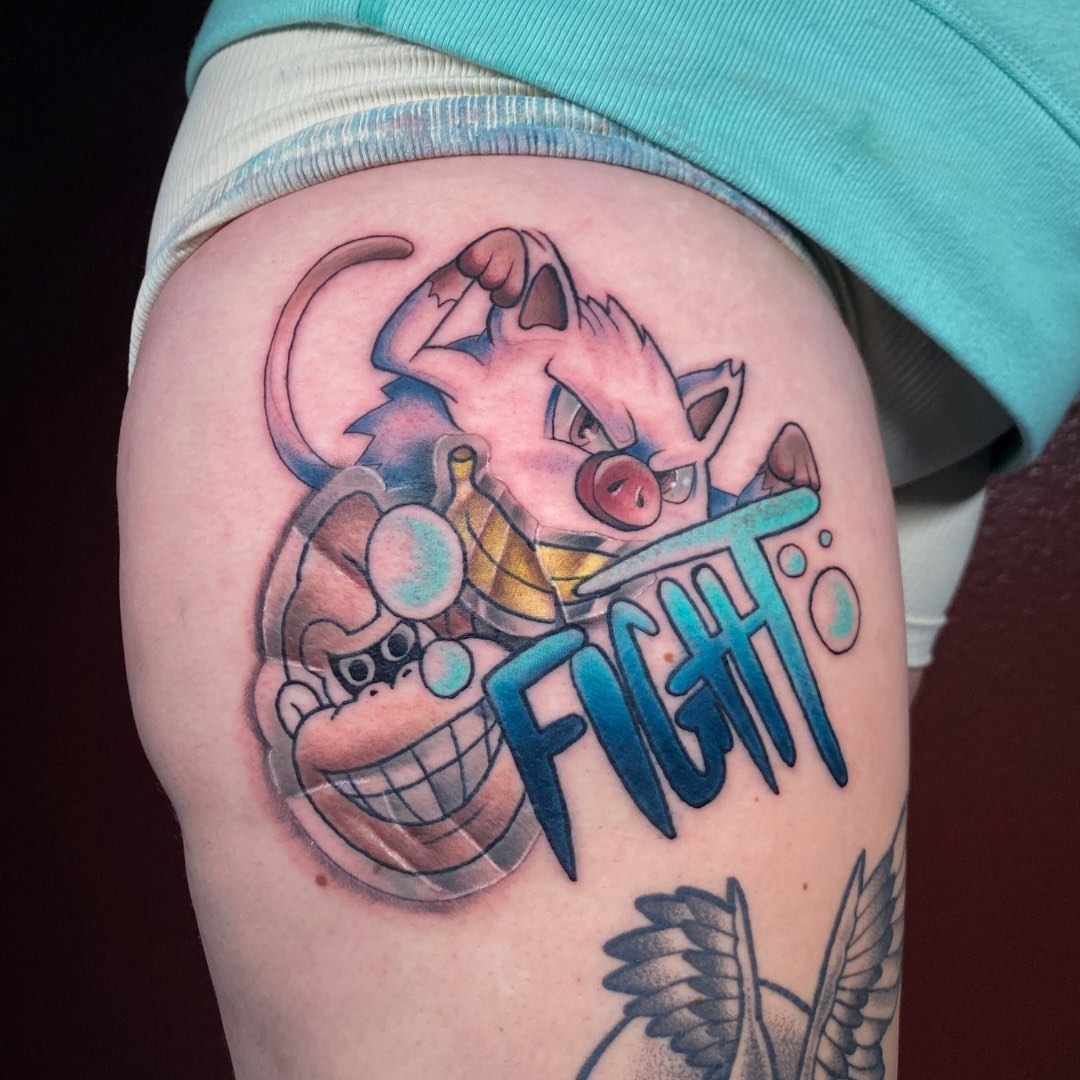 Fight new school tattoo on the thigh by Brian Overholt