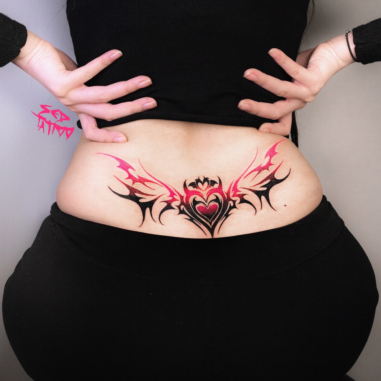 Heart with wings tribal tattoo on the torso by Sed