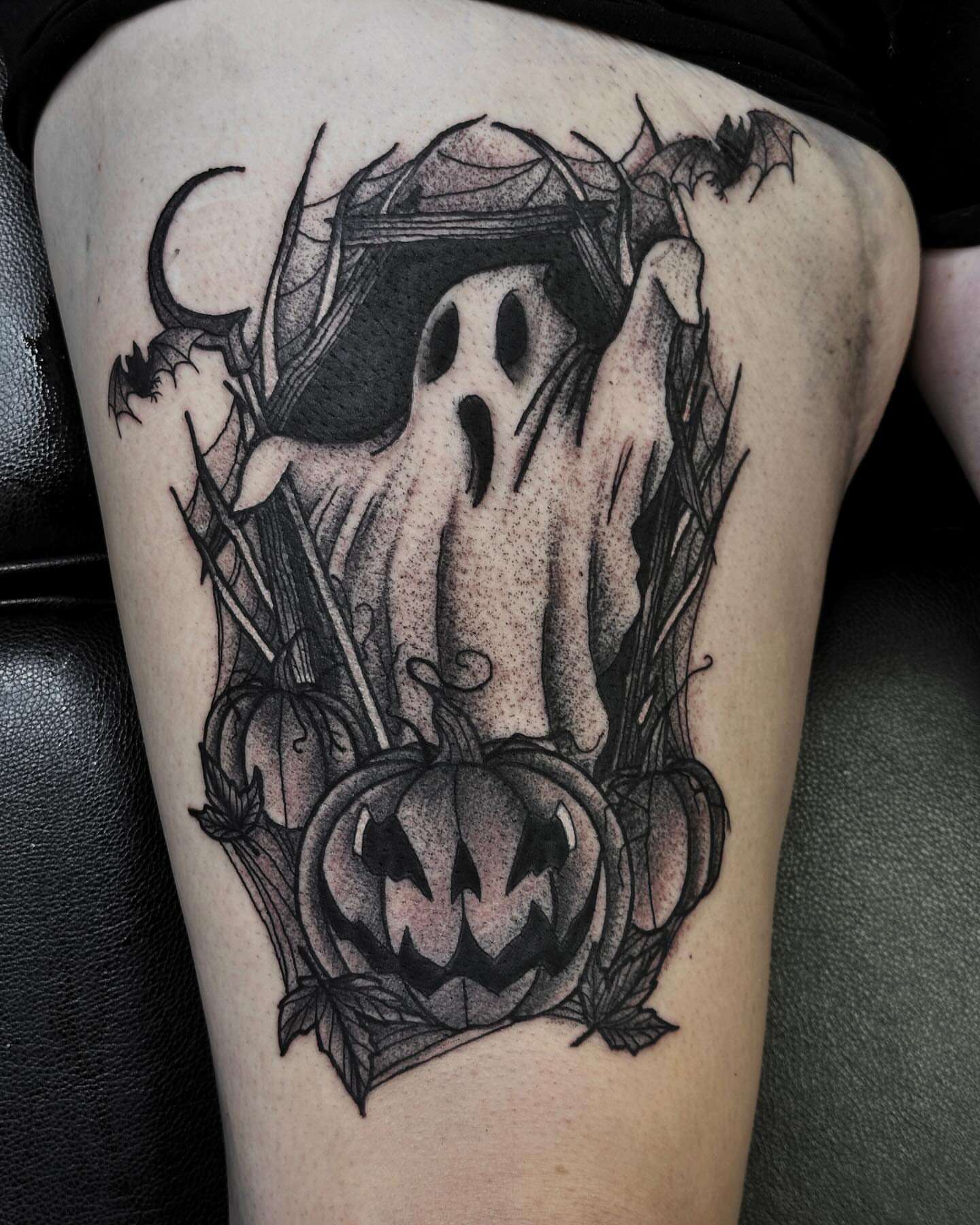 Ghost and jack-o'-lantern dotwork tattoo on the thigh by Elizabeth Tabler