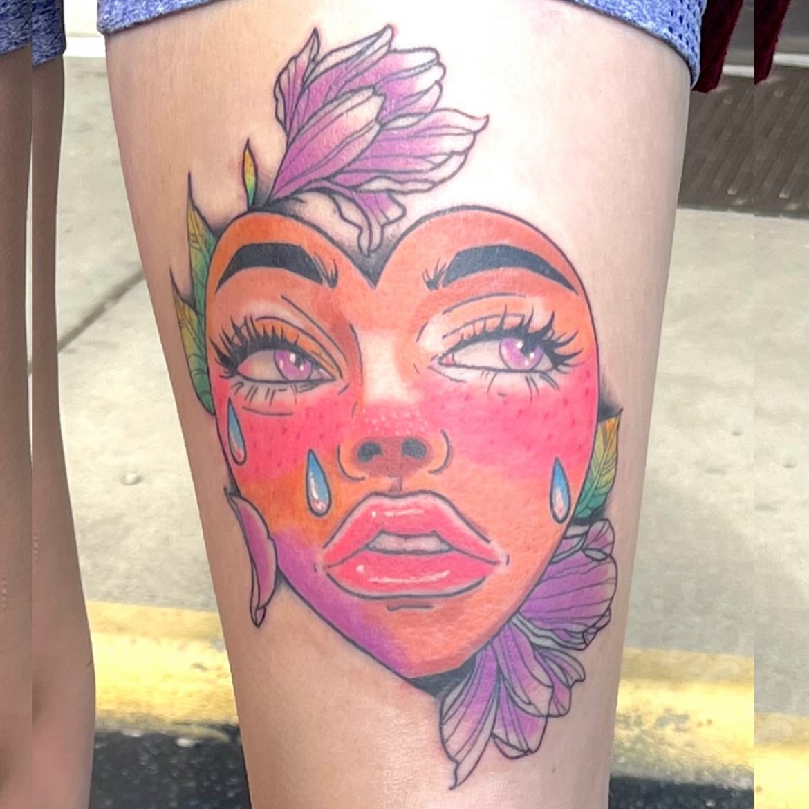 Woman's face illustrative tattoo on the thigh by Deville Pinson