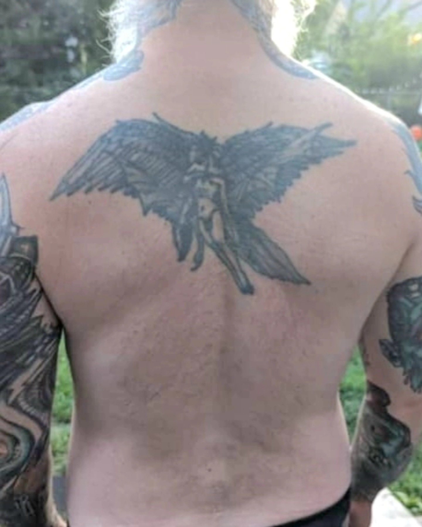 Winged angel black and grey tattoo on the back by Scott Fricke