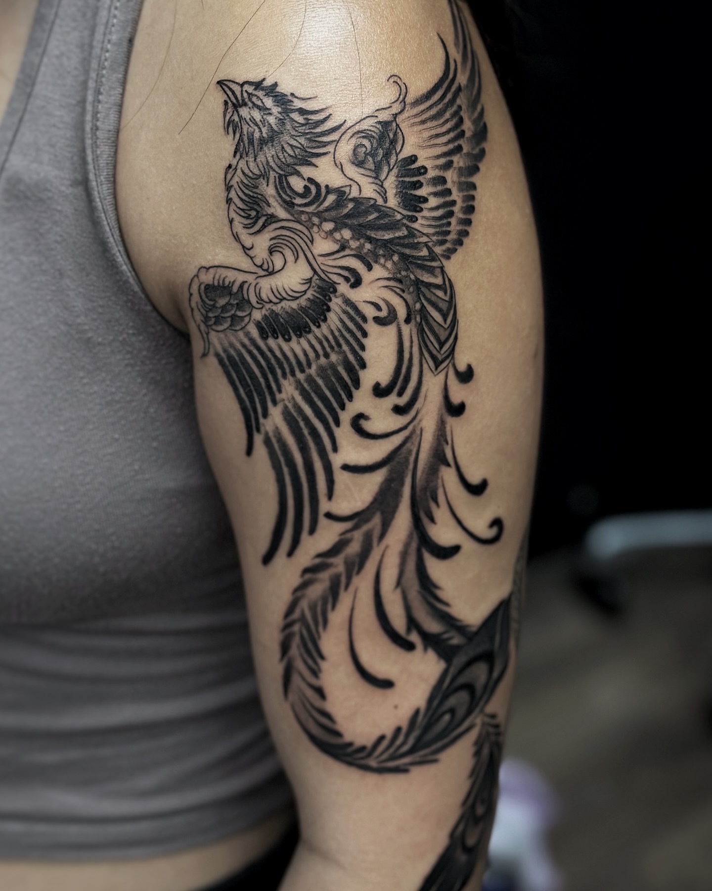 Owl black and grey tattoo on the forearm by Alejo Ibanez Tattoo