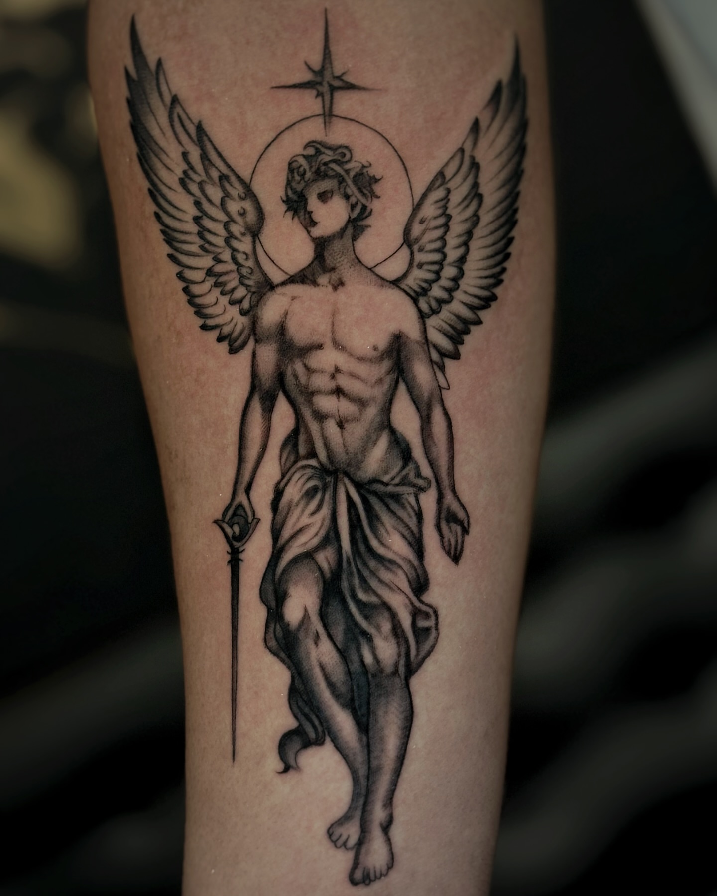Angelic figure realism tattoo on the forearm by Alejo Ibanez Tattoo
