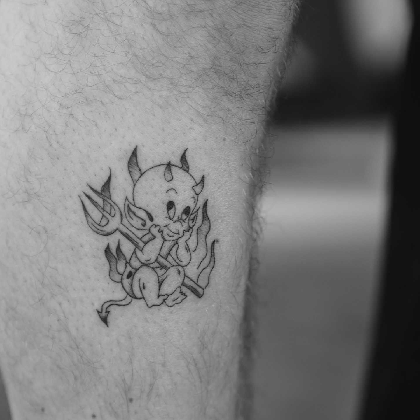Baby devil black and grey tattoo on the forearm by Mady