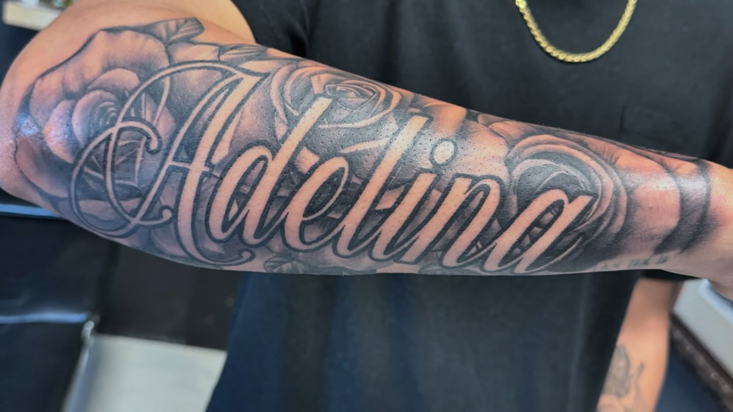 Adelina realism tattoo on the forearm by Joseph Marshall