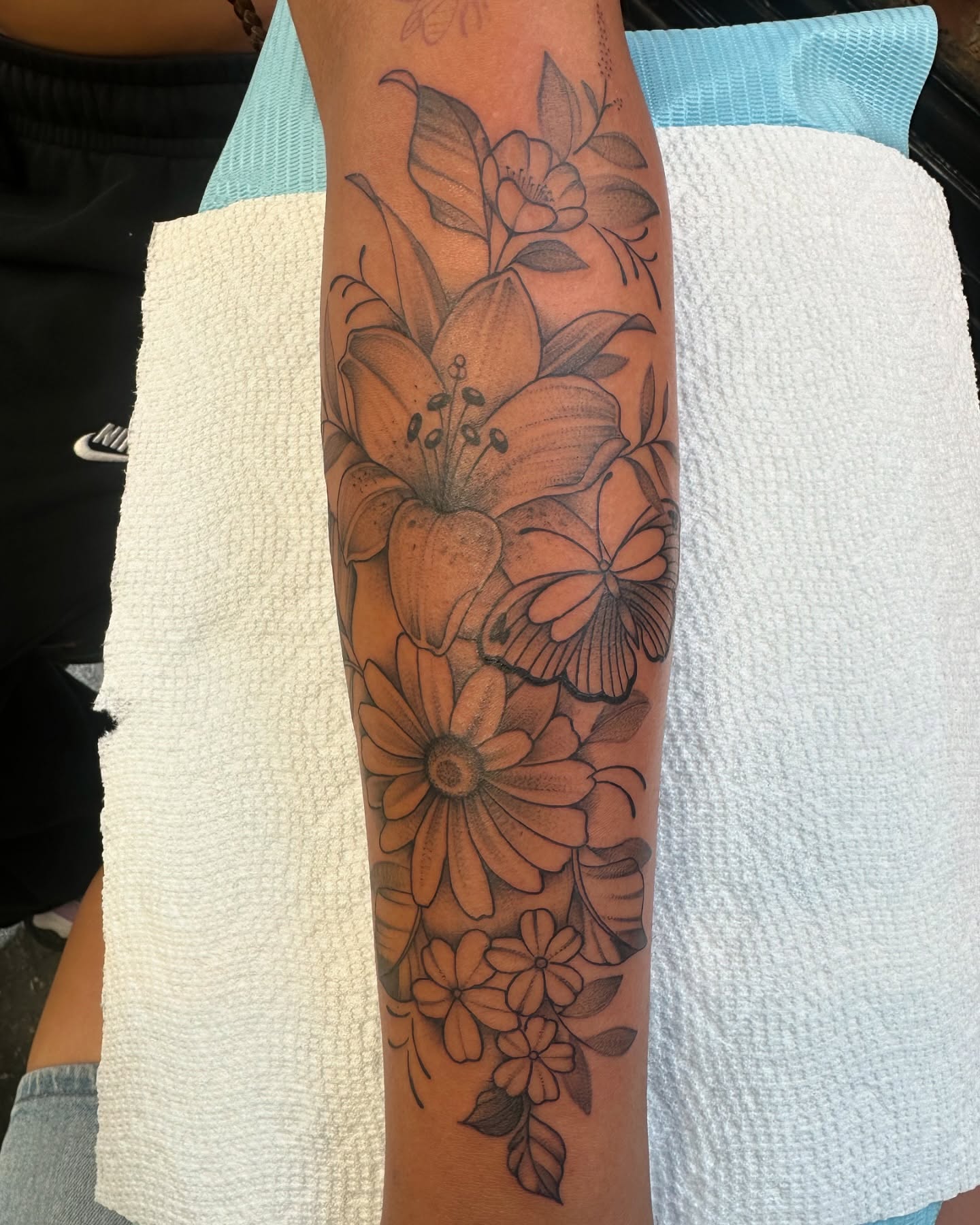 Floral arrangement black and grey tattoo on the forearm by Baung Ben