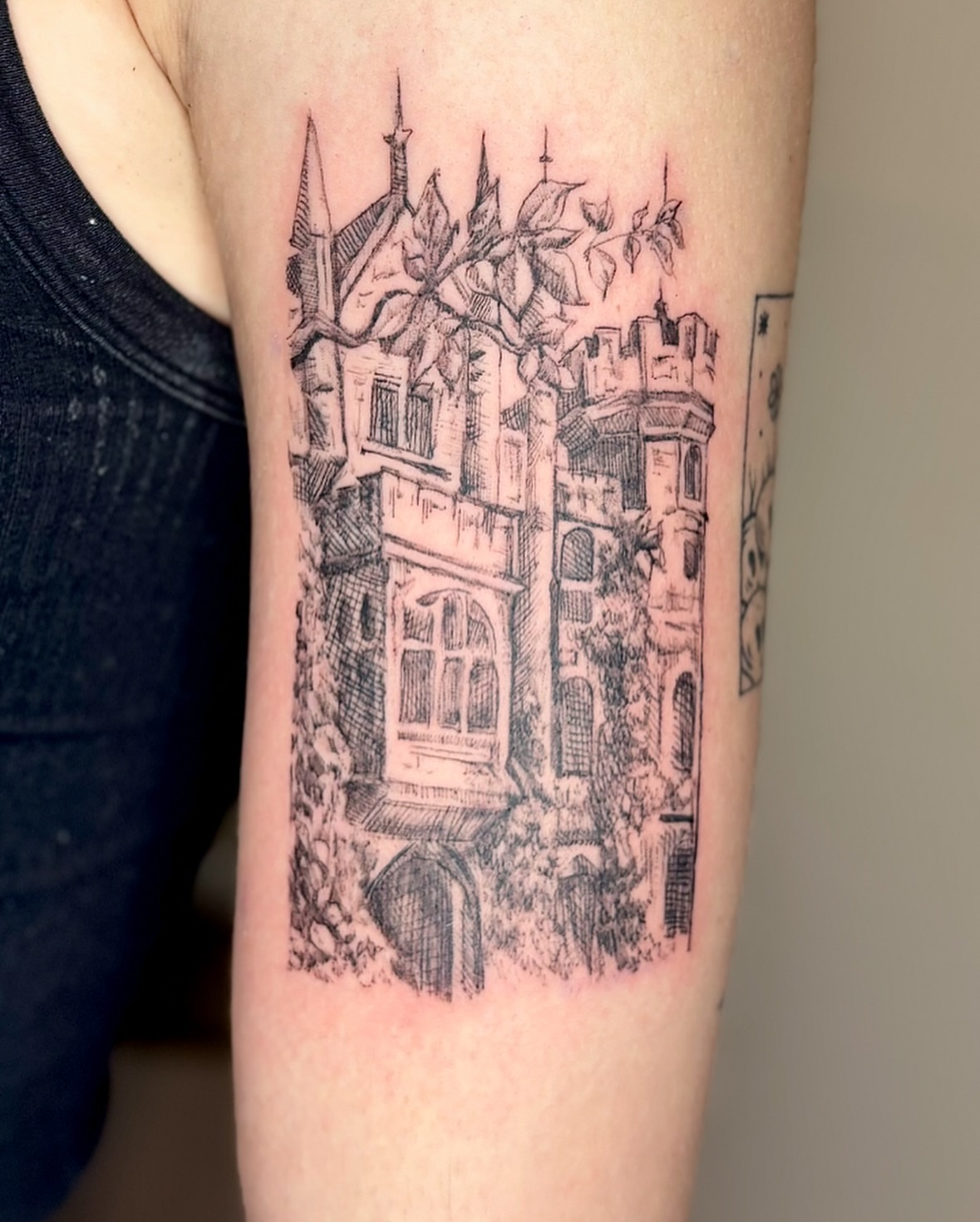 Castle black and grey tattoo on the forearm by Wren Cavanaugh Tattoos, Seattle, Washington