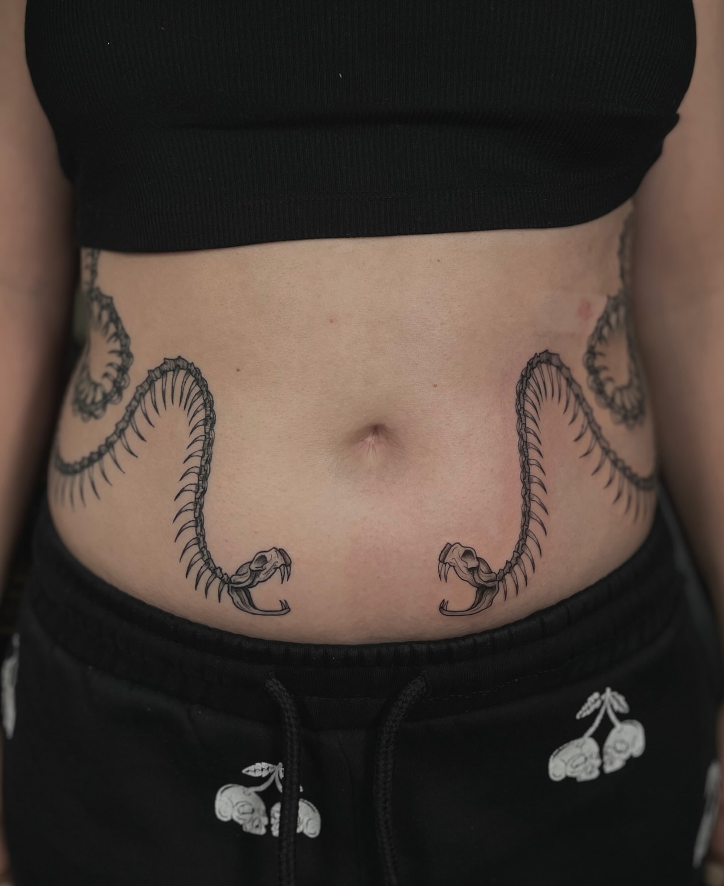 Snakes black and grey tattoo on the torso by Koko