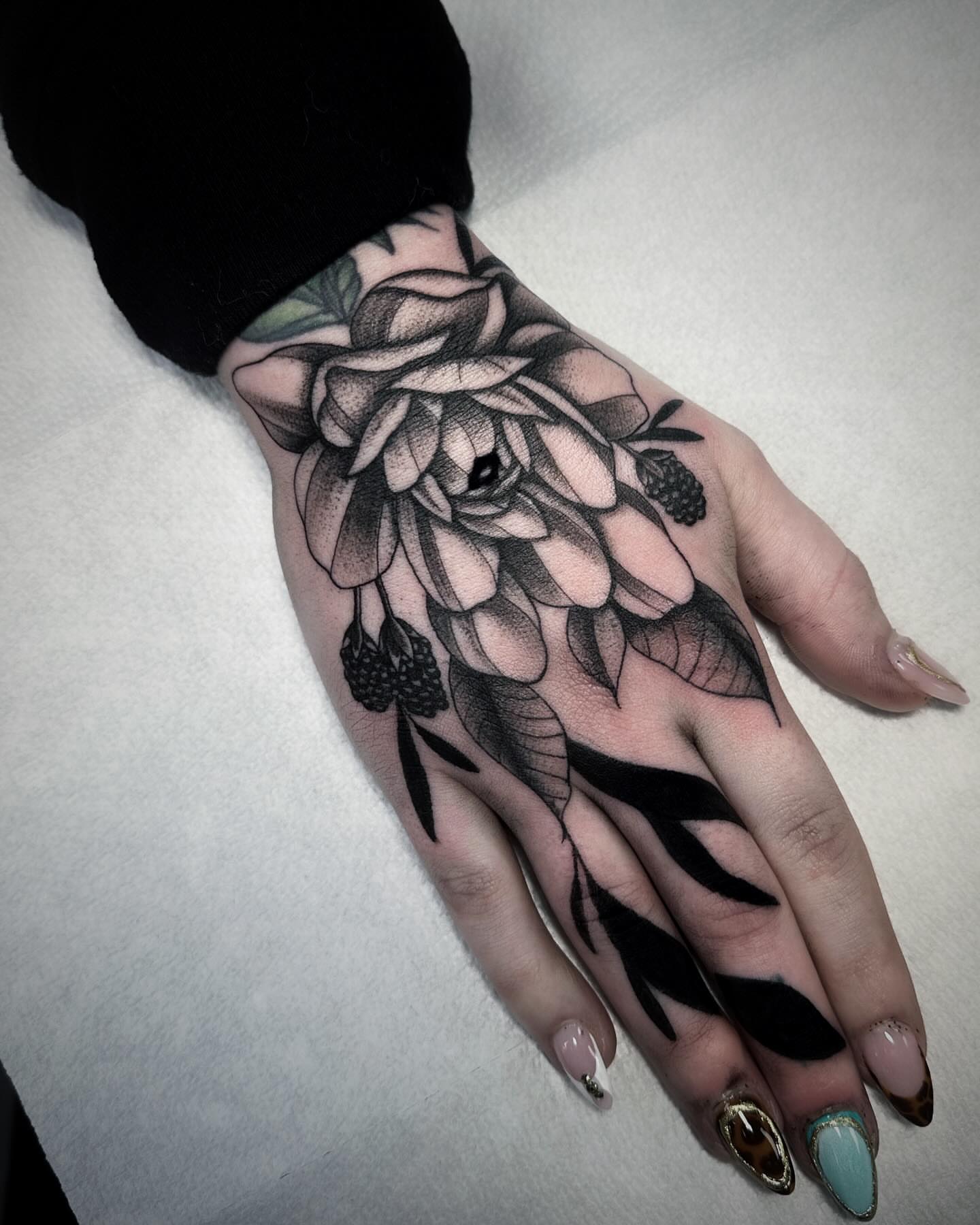 Flower black and grey tattoo on the hand by 🕸 ᴠɪᴠɪᴀɴ ʟᴏʀᴇ 🕸, Nashville, Tennessee