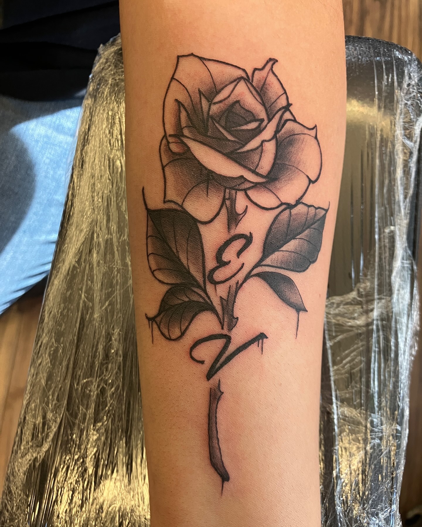 Rose black and grey tattoo on the forearm by Hot Dawg
