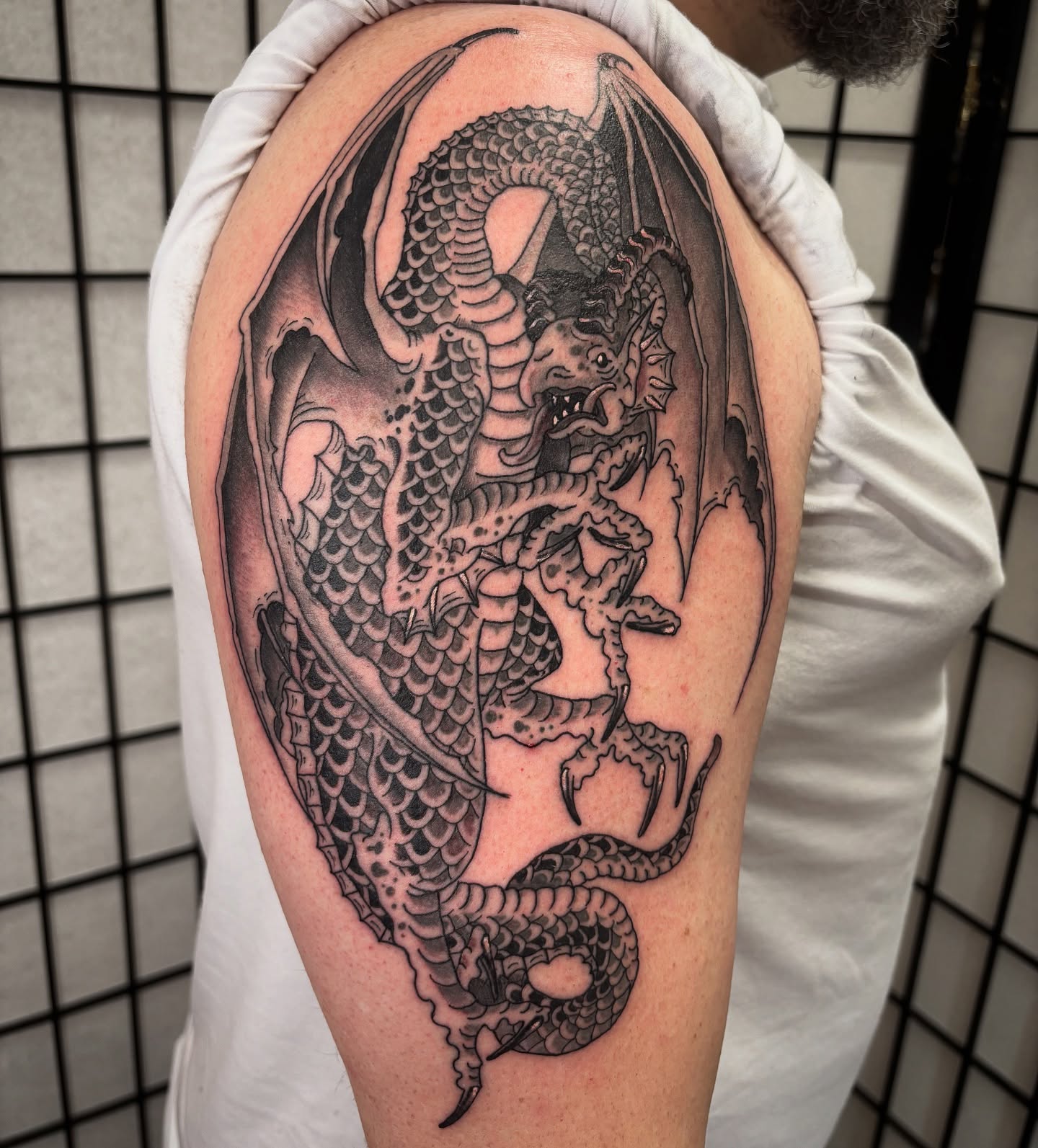 Dragon black and grey tattoo on the shoulder by Adam Bailey, Portland, Oregon