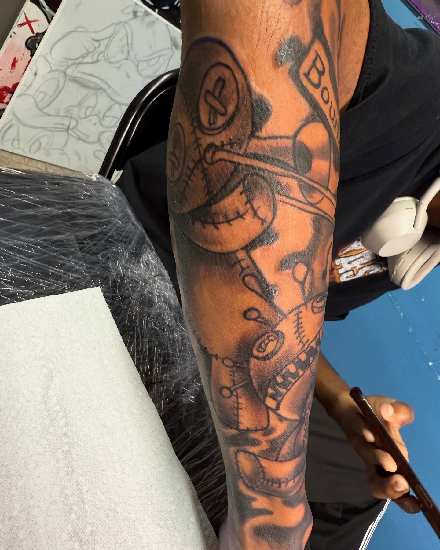 Stitch doll black and grey tattoo on the forearm by Mr. Tatt2Junkiee 💉🧟