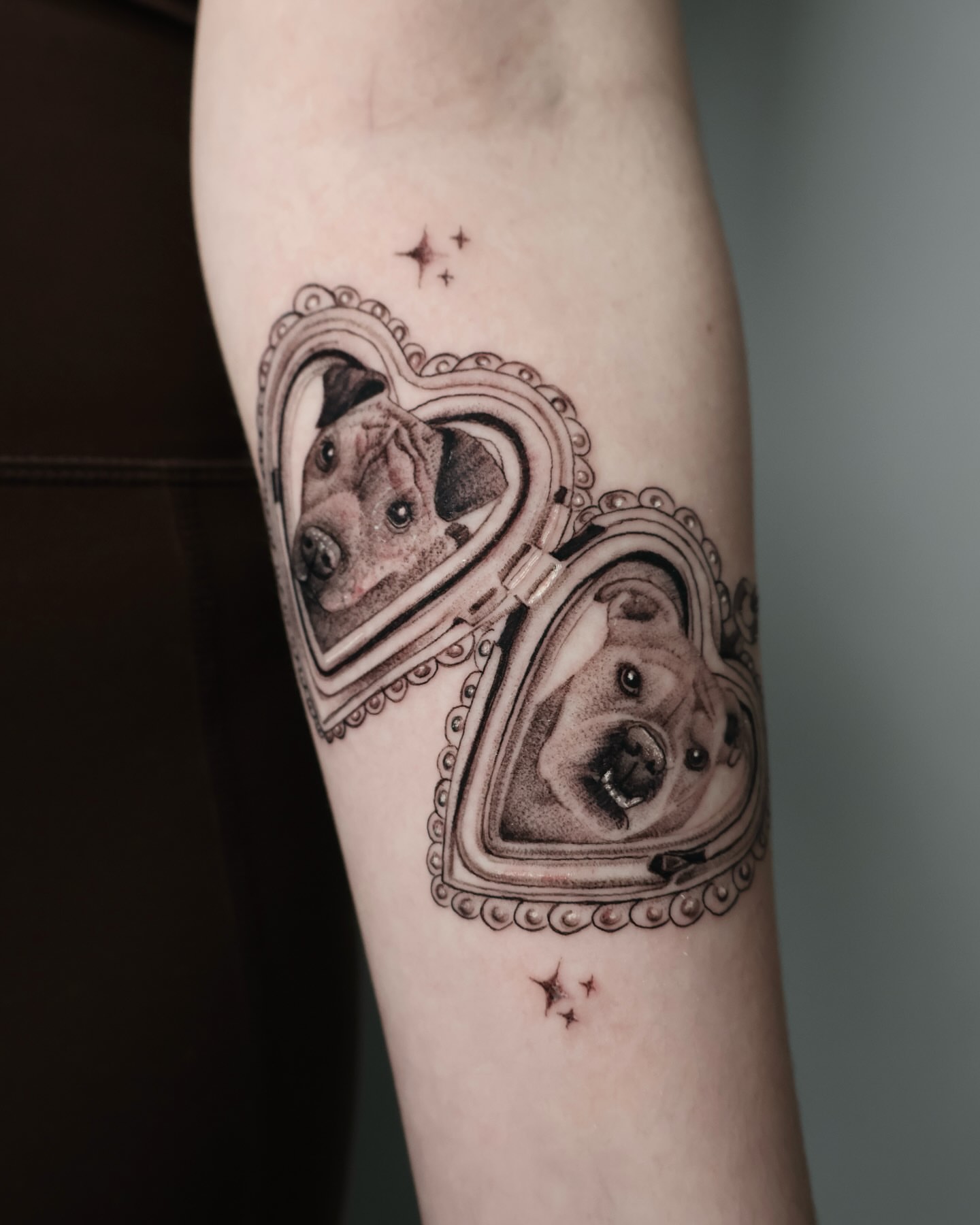 Dog in heart dotwork tattoo on the forearm by Stephanie Pedraza