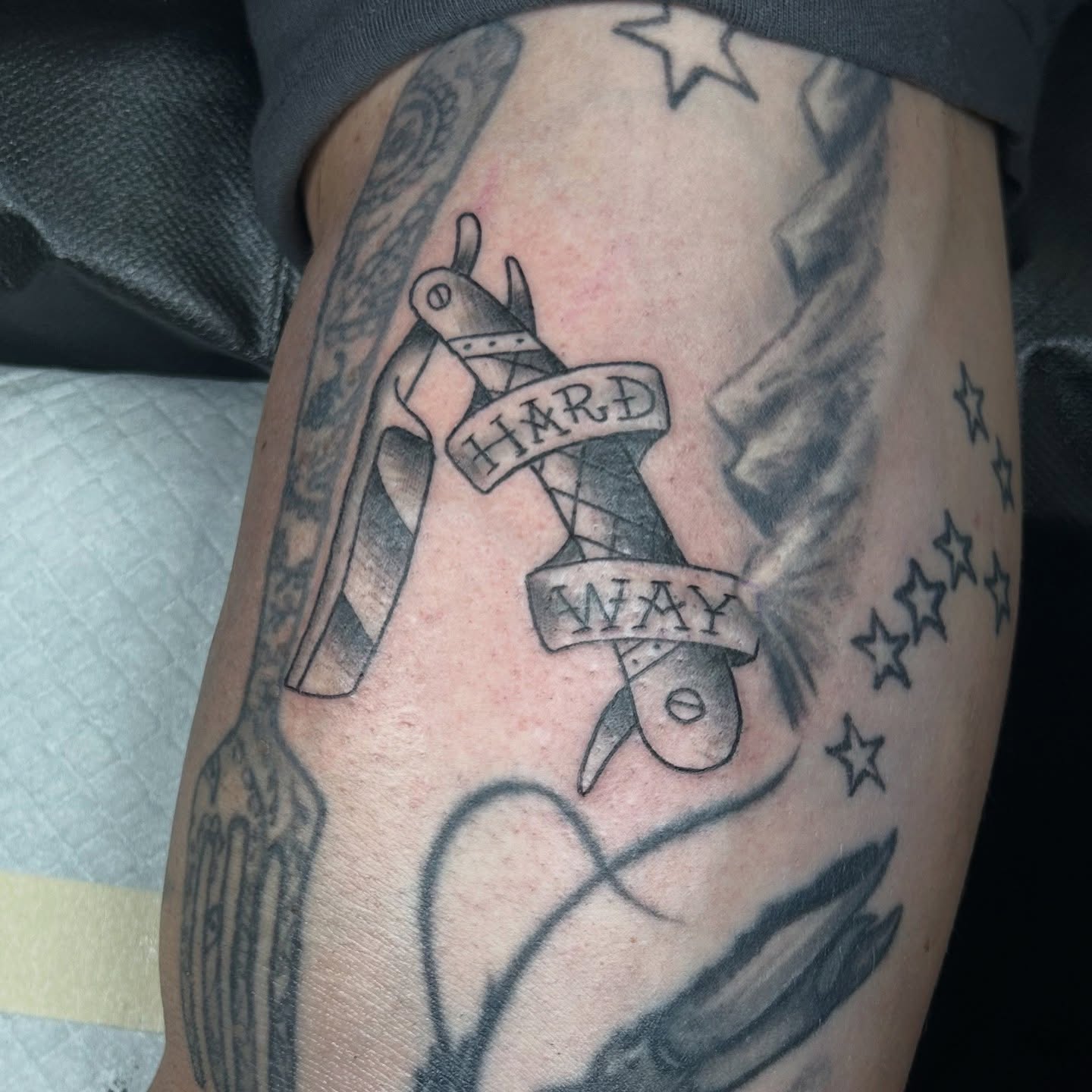 Scissors and ribbon American traditional tattoo on the thigh by ✨ Jess ✨, Moncks Corner, South Carolina
