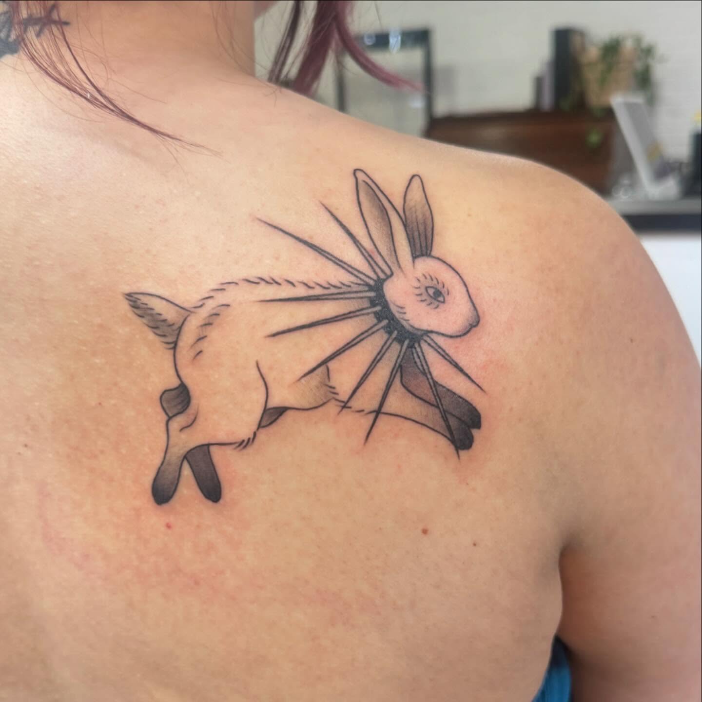 Rabbit black and grey tattoo on the shoulder by Makayla Dupre