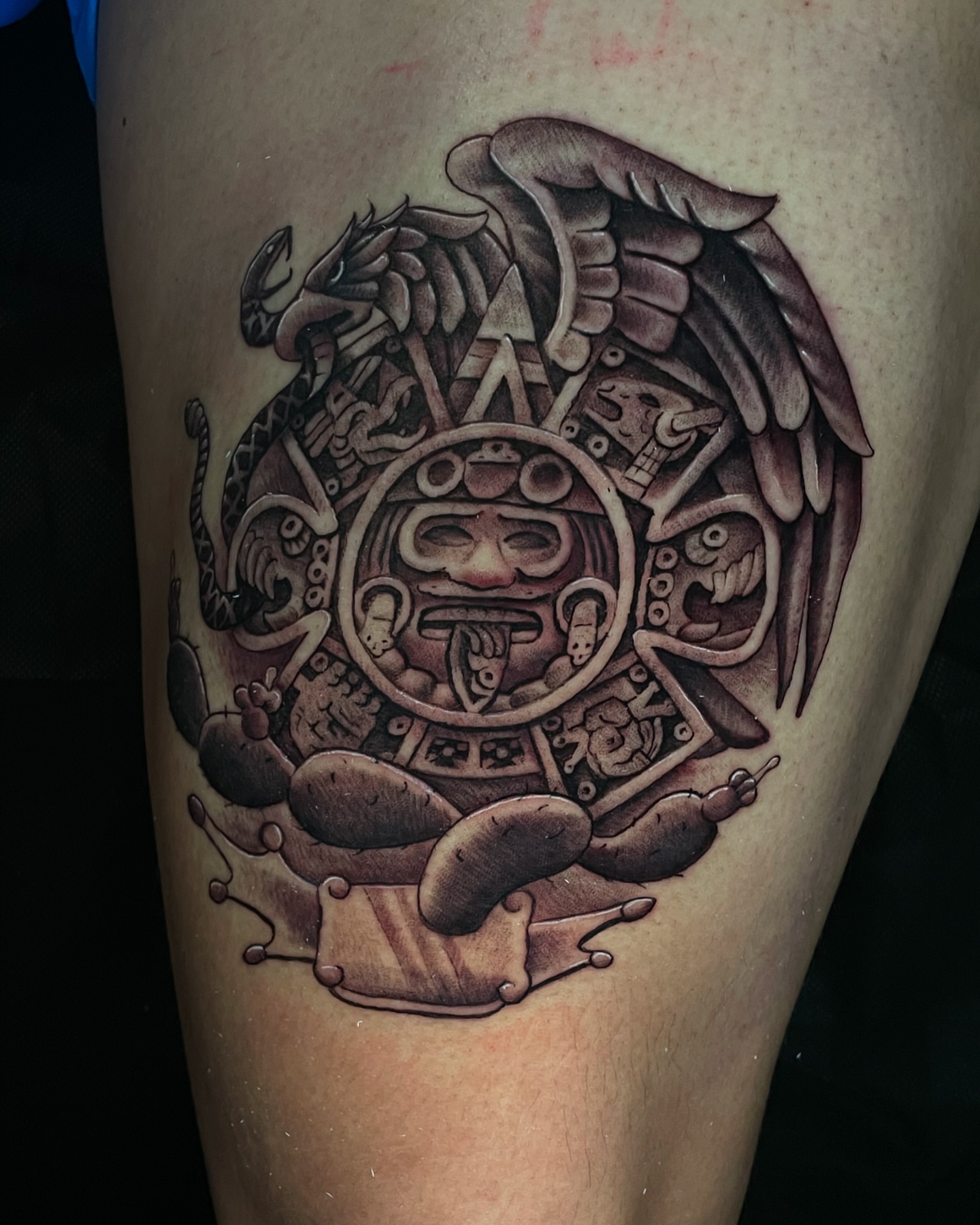 Mayan calendar black and grey tattoo on the thigh by Vic