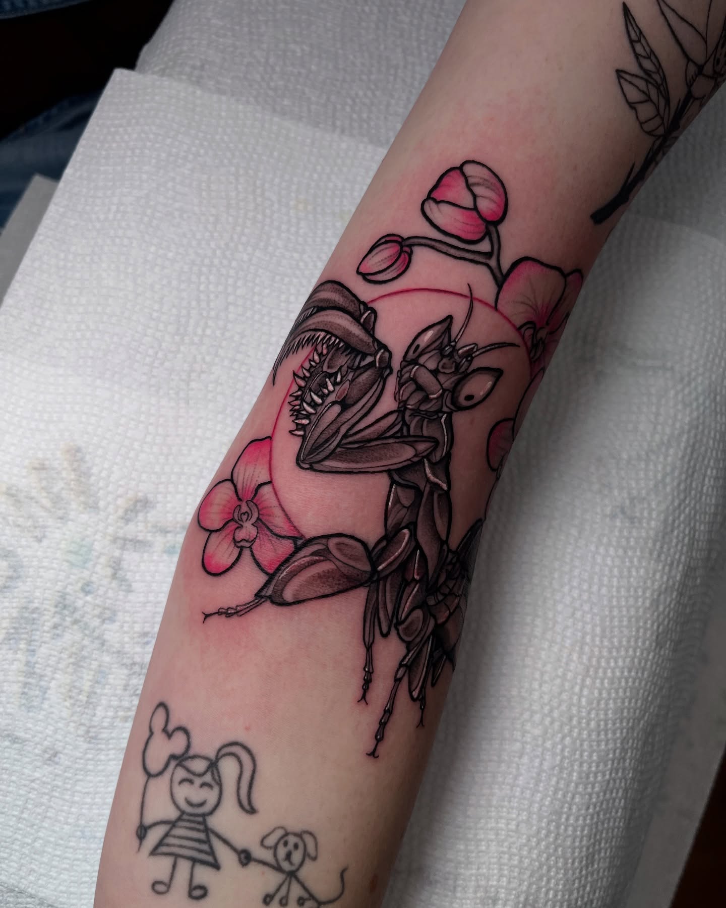 Insect and flowers black and grey tattoo on the forearm by ʙᴇᴄᴄᴀ ʟʏɴɴ