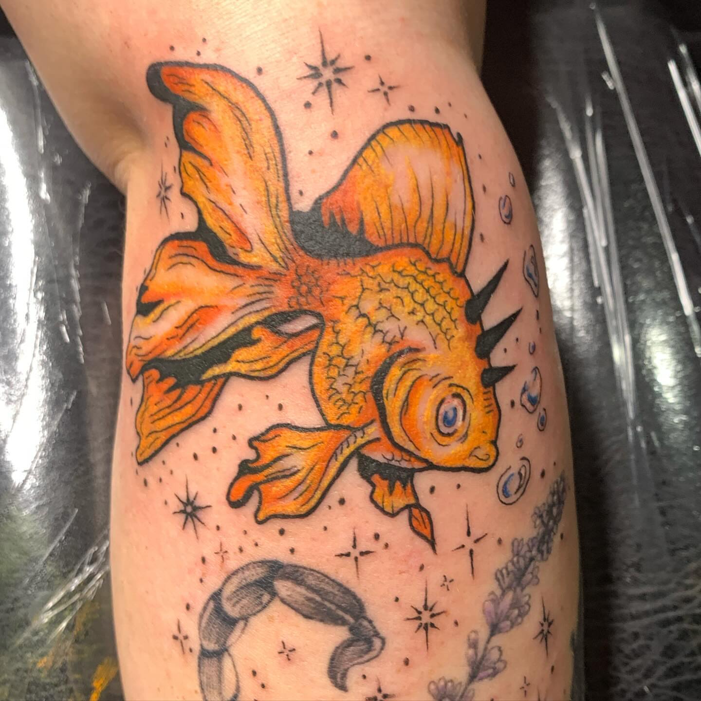 Goldfish American traditional tattoo on the forearm by Ava Glory Tattoos
