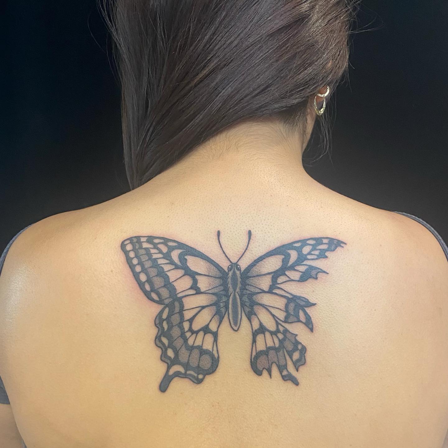 Butterfly black and grey tattoo on the back by Krista - Tattoo Artist