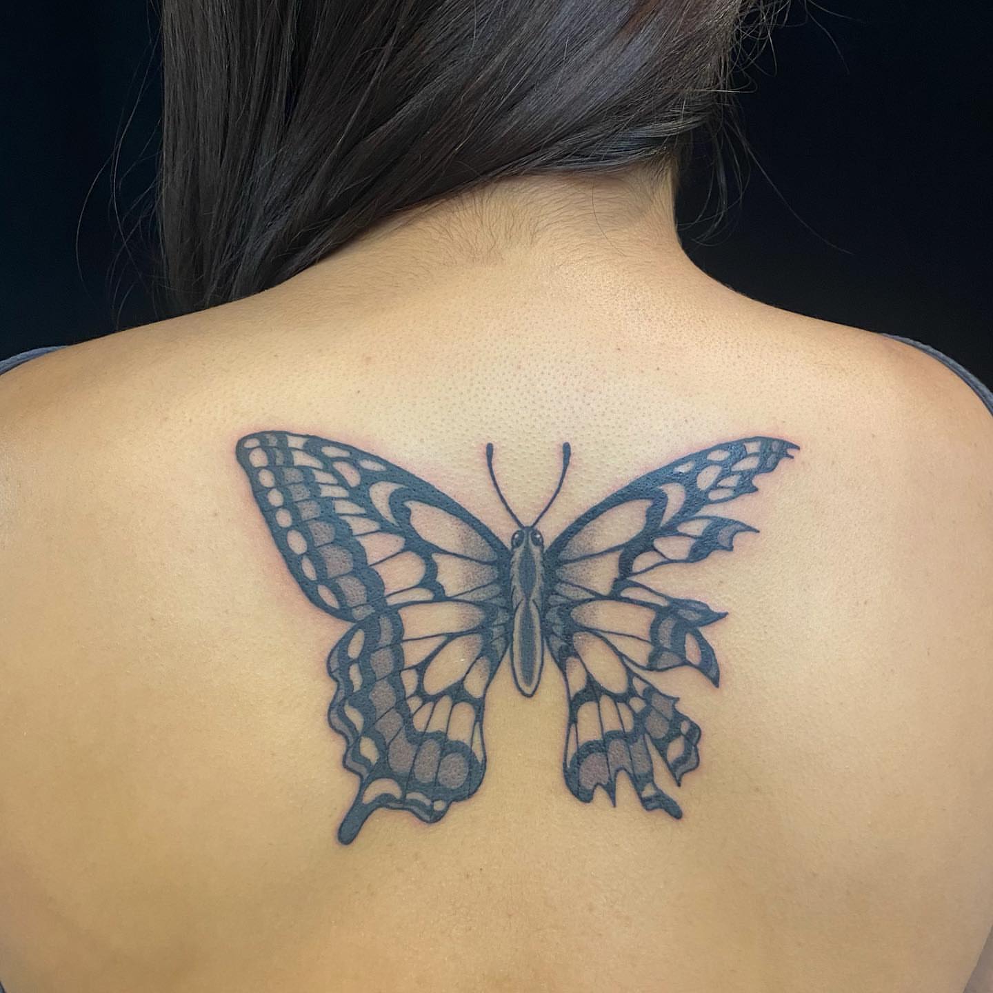 Butterfly black and grey tattoo on the back by Krista - Tattoo Artist