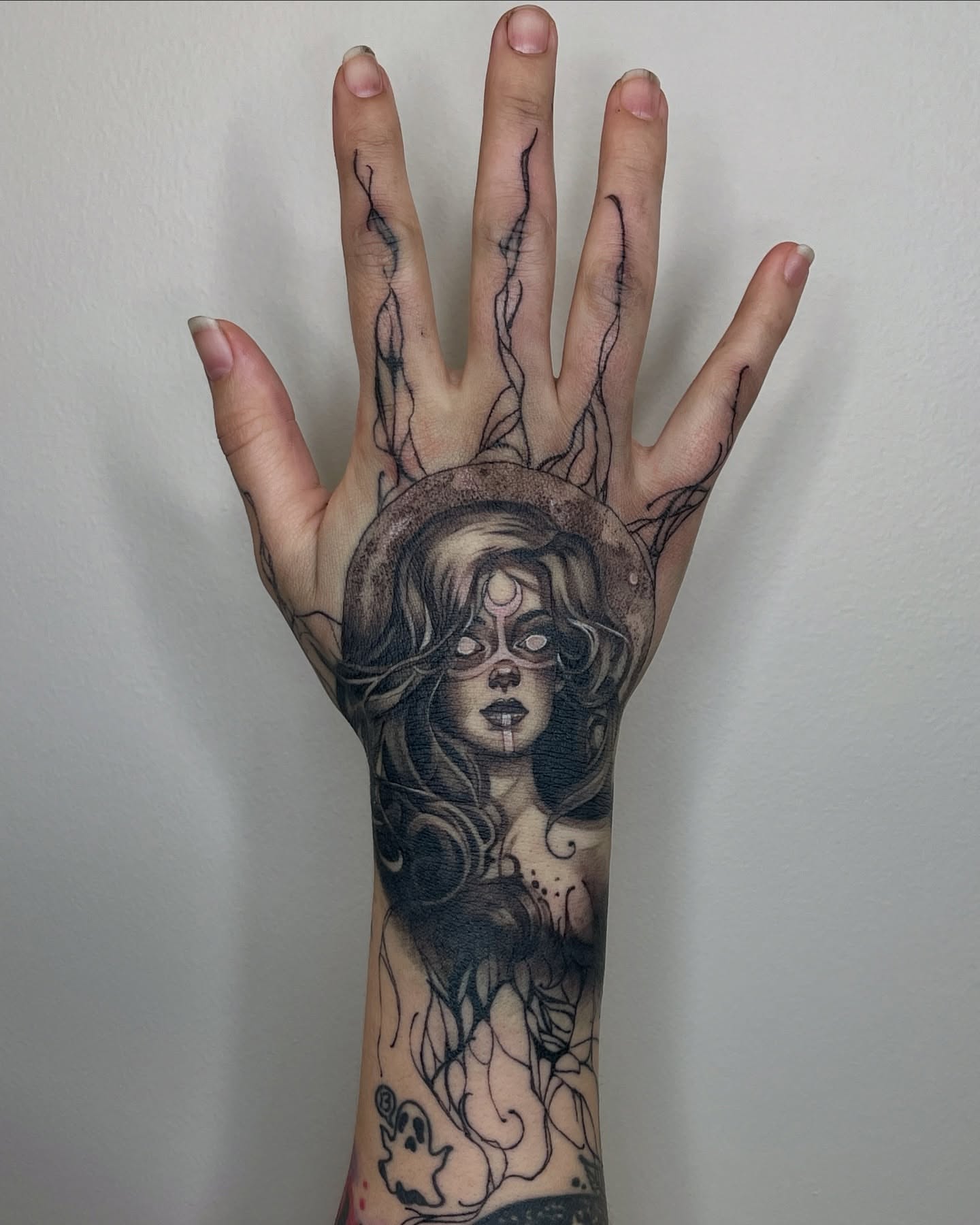 Woman with hat realism tattoo on the hand by Melissa Rose Moya