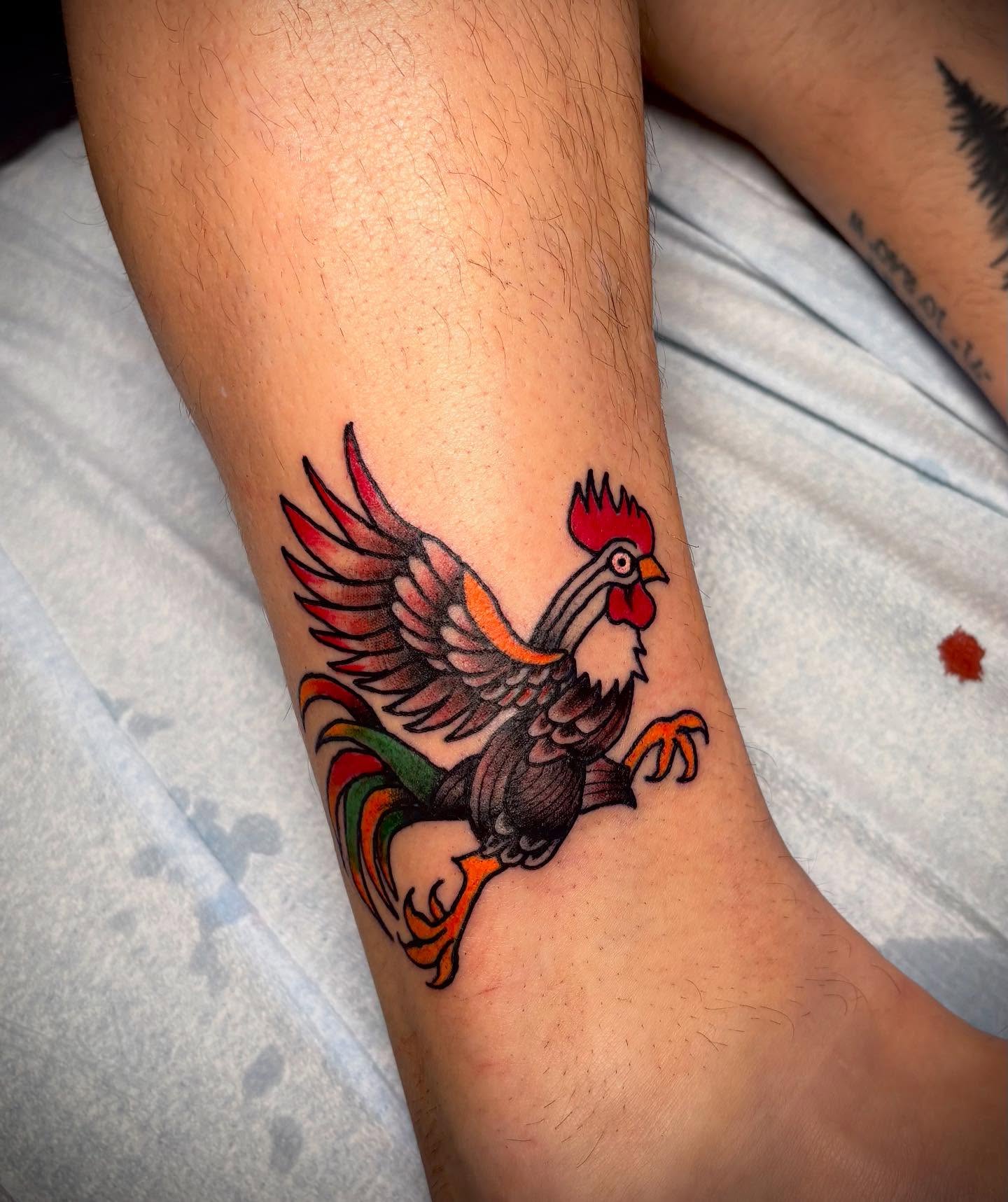 Rooster American traditional tattoo on the forearm by Nolan Croteau