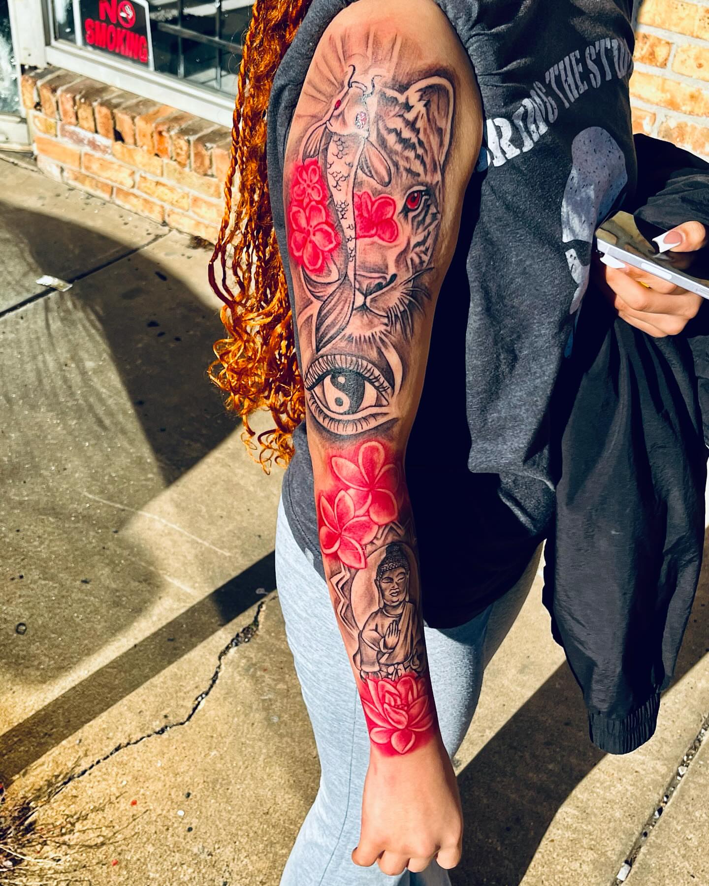 Tiger and lotus flowers realism tattoo on the forearm by GrindHard Quen