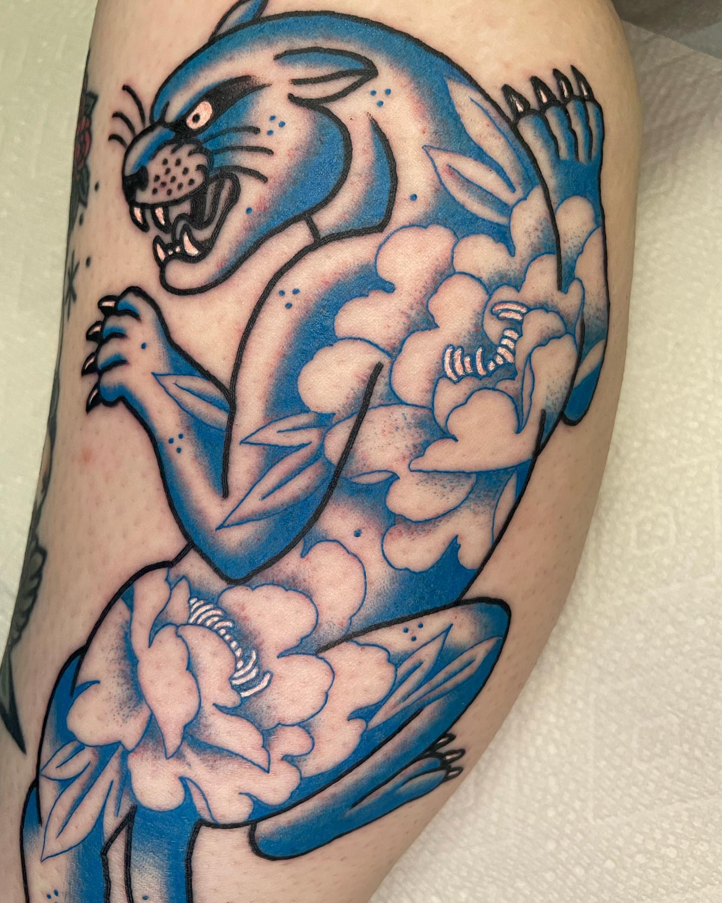 Panther and flowers American traditional tattoo on the thigh by Seattle Tattoo Artist, Bonney Lake, Washington