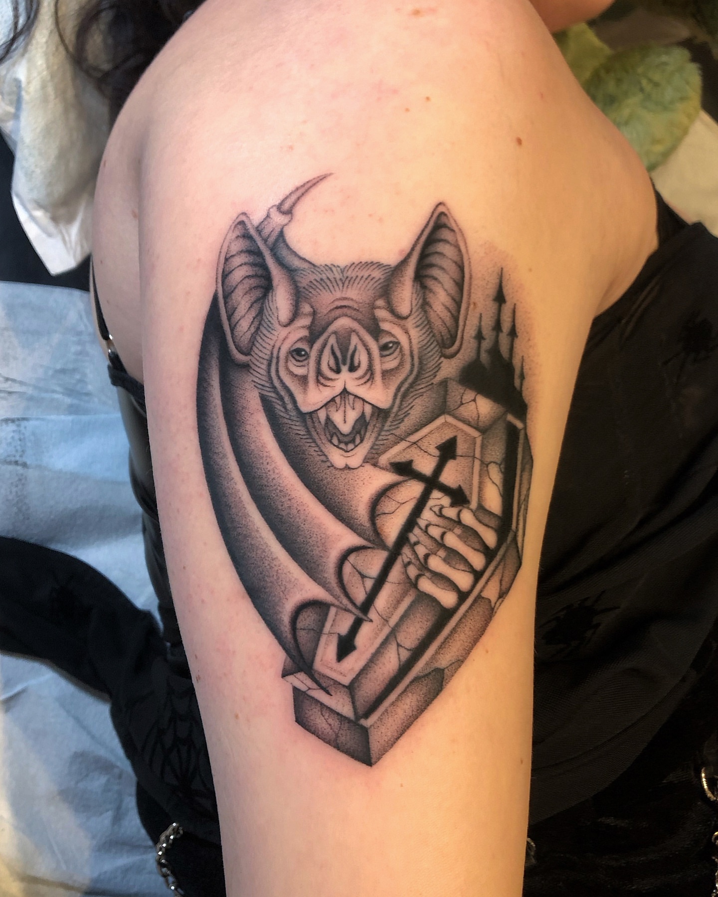 Demon holding cross geometric tattoo on the shoulder by Mickey