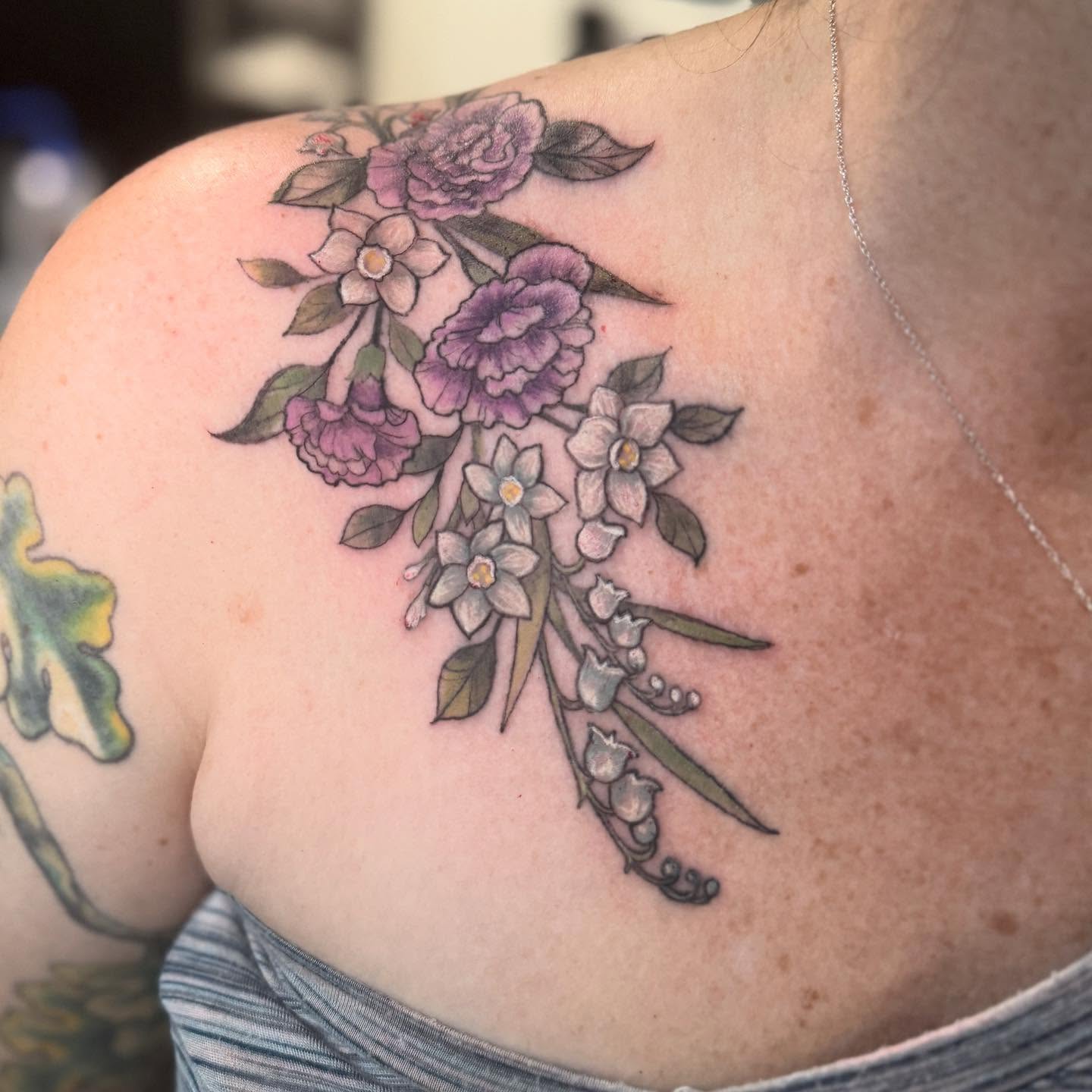 Floral bouquet realism tattoo on the shoulder by đź’›Kristinađź’› tattoos with intention, Minneapolis, Minnesota