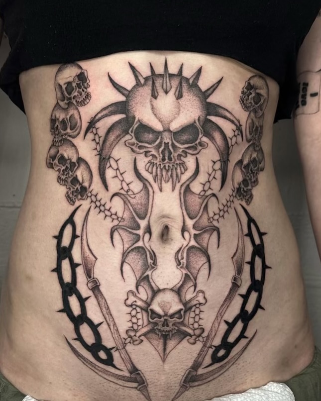 Skulls and thorns dark realism tattoo on the torso by 𝖍𝖆𝖓𝖓𝖆𝖍