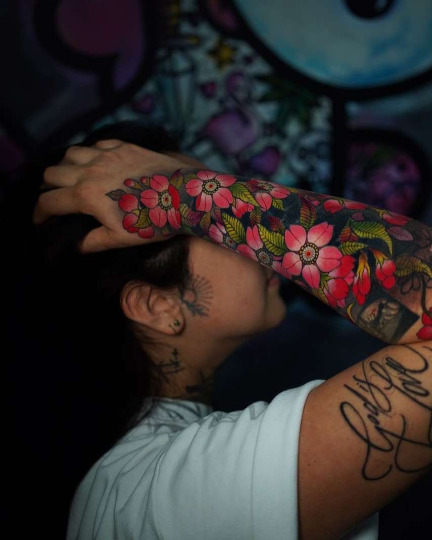 Cherry blossoms new school tattoo on the upper arm by Katherin Plaza