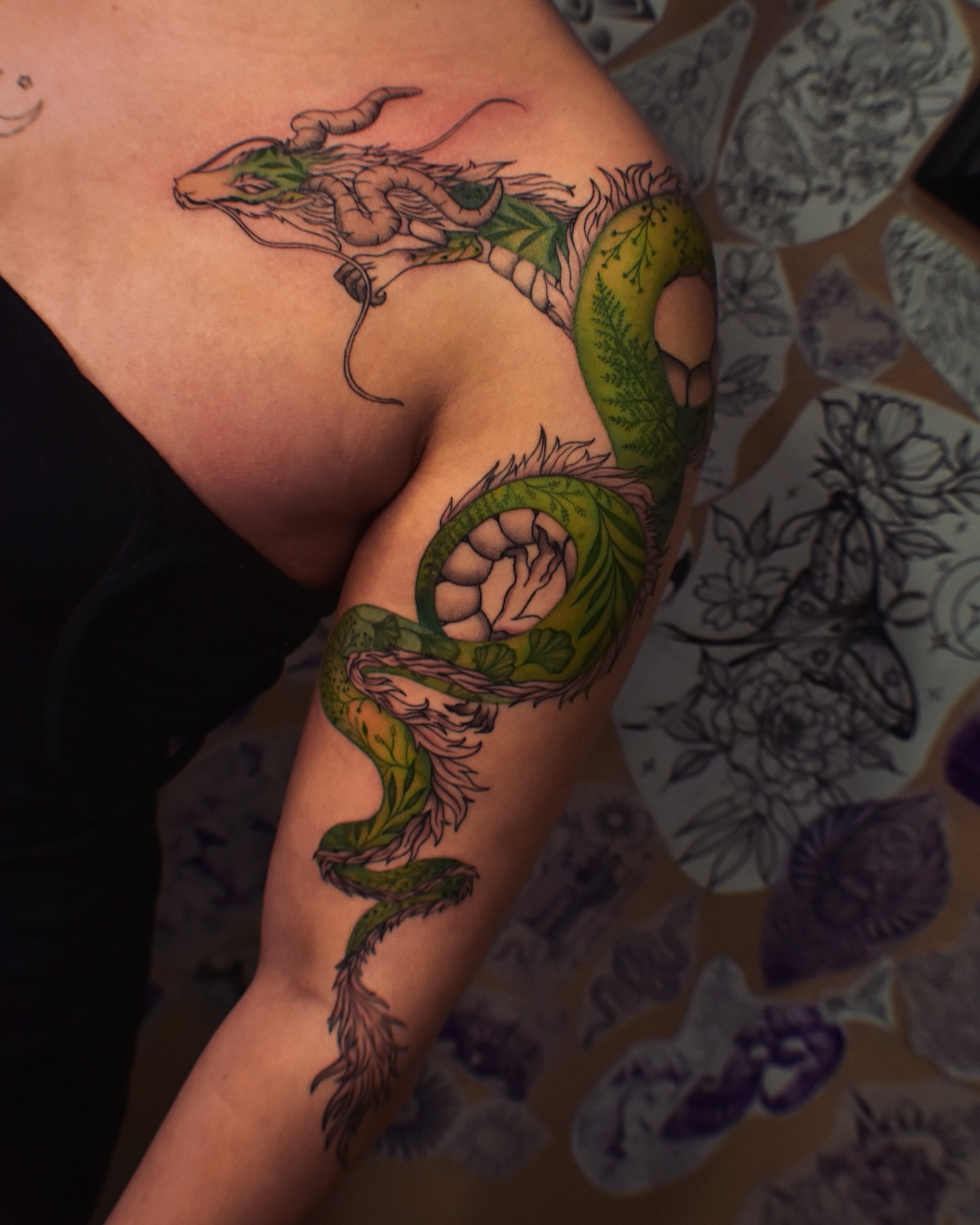 Dragon new school tattoo on the upper arm by Alexandria Gudiel