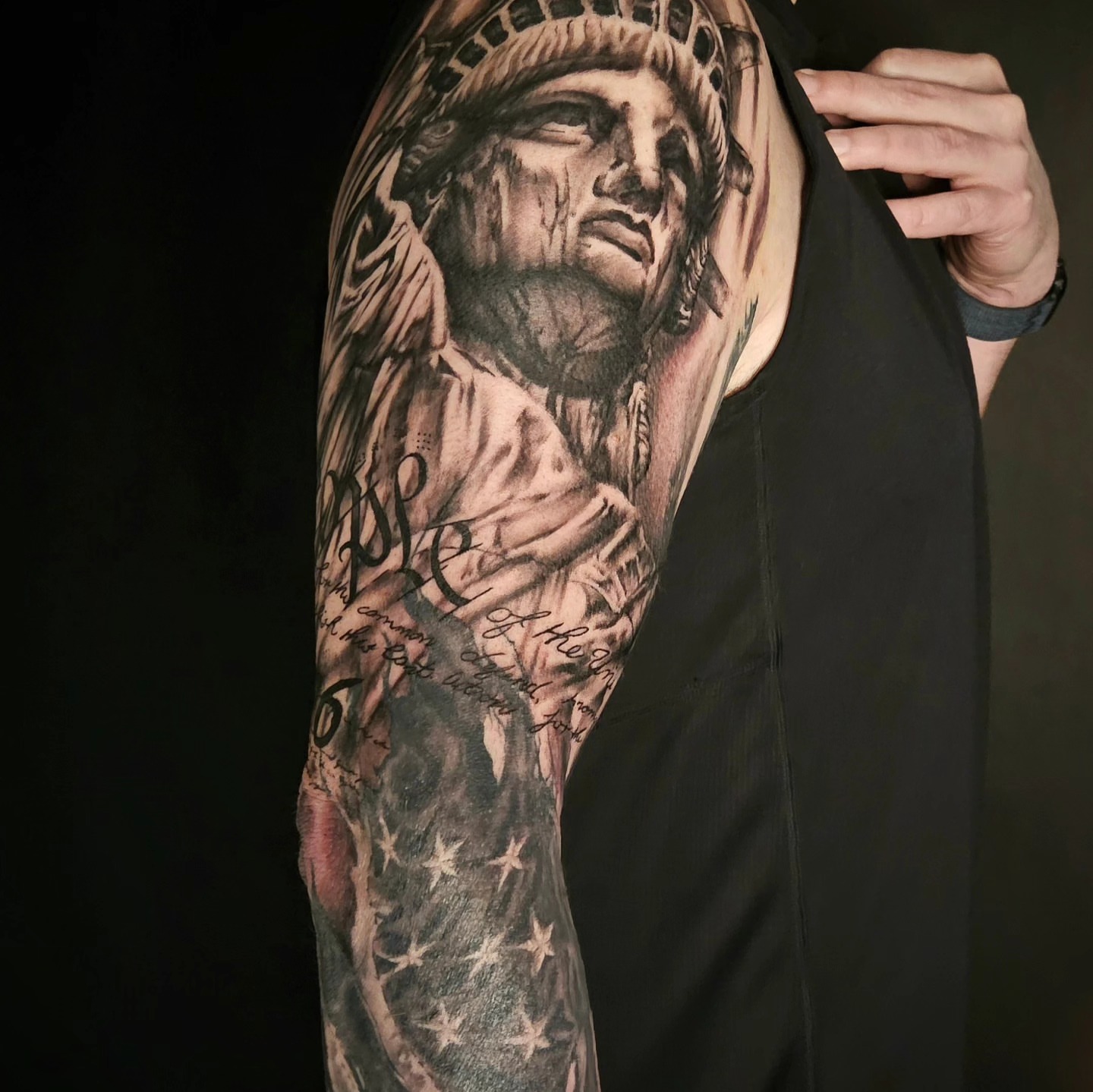 Statue of liberty realism tattoo on the upper arm by Chicagoland Tattoo artist - Dany Rojas