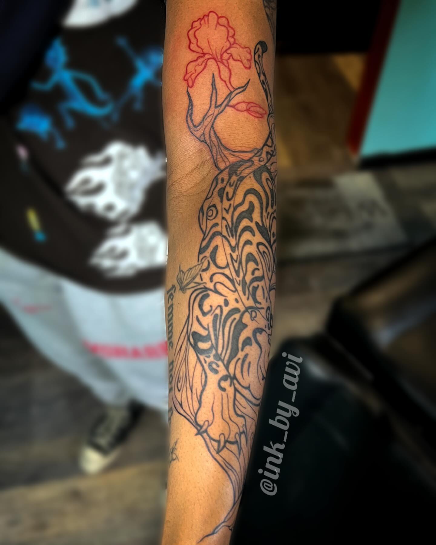 Tree with flowers black and grey tattoo on the forearm by Avi, Cleveland, Ohio