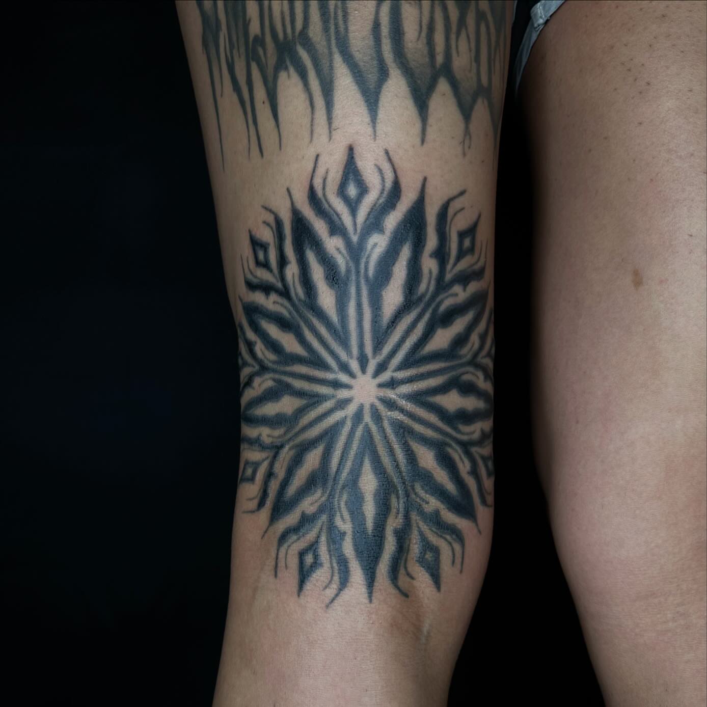 Snowflake geometric tattoo on the forearm by Jay Morales