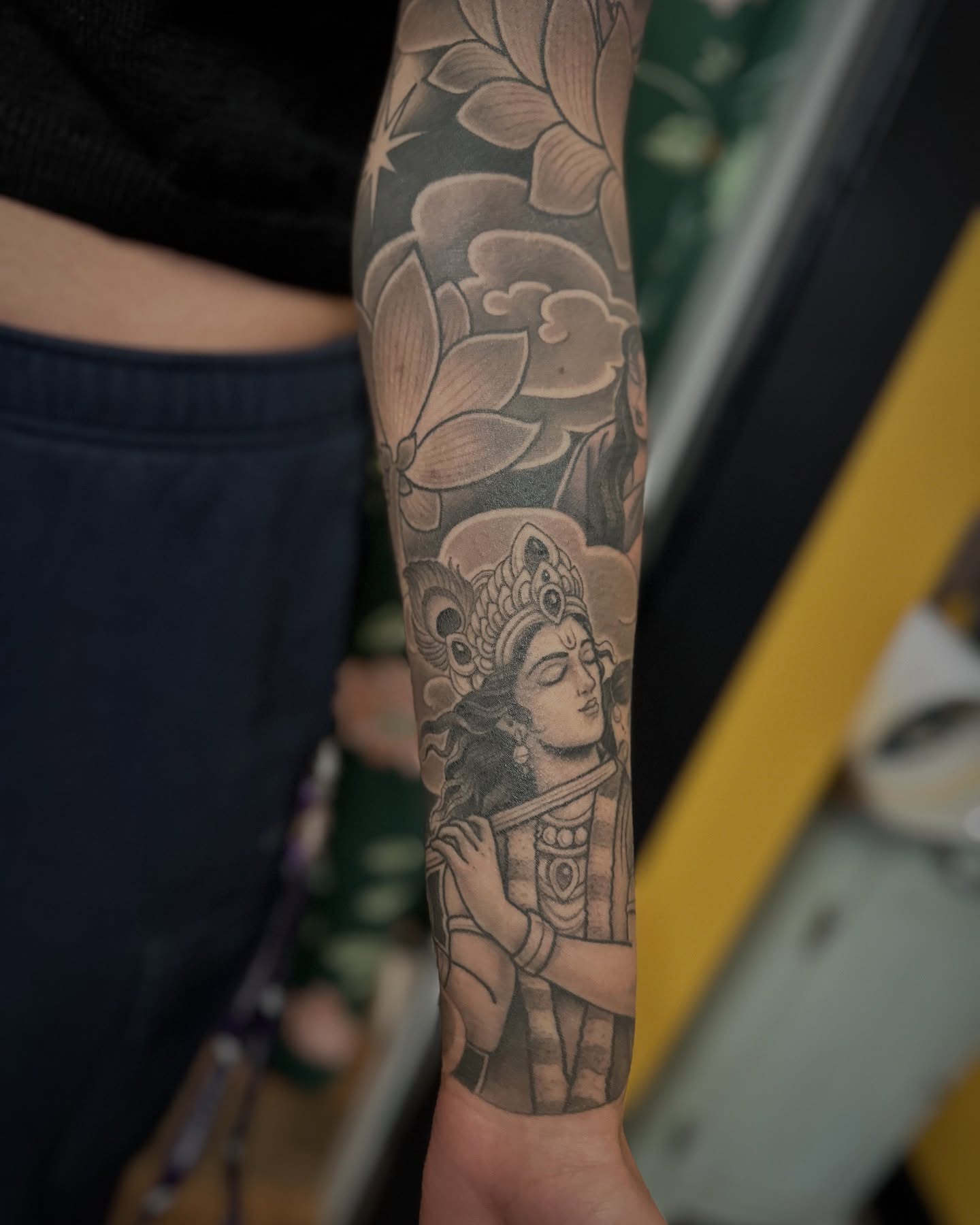 Deity with lotus realism tattoo on the forearm by Megon Shore, Seattle, Washington