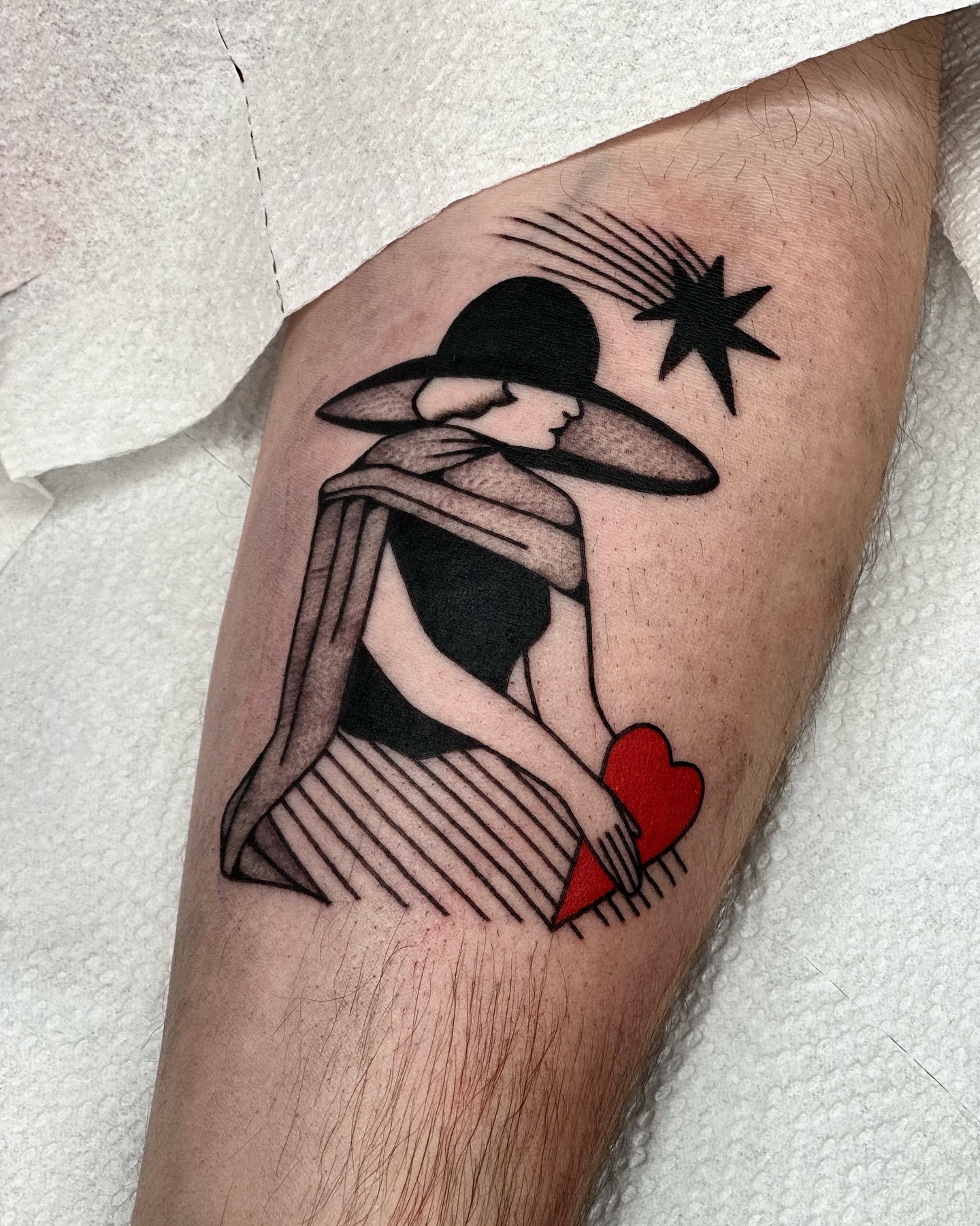 Woman with heart black and grey tattoo on the forearm by Maks