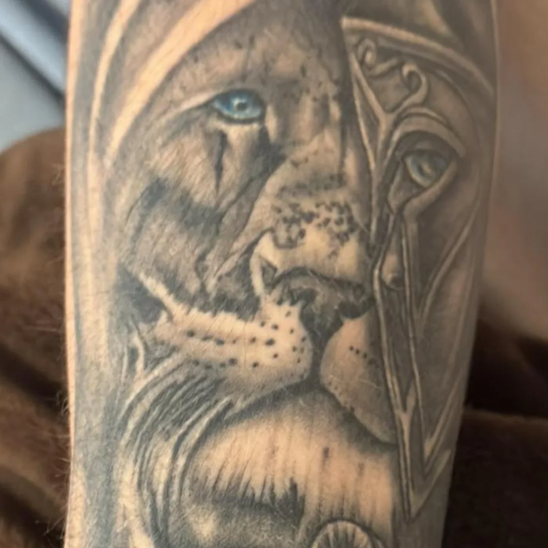 Lion realism tattoo on the forearm by Dave Johnson, Billings, Montana