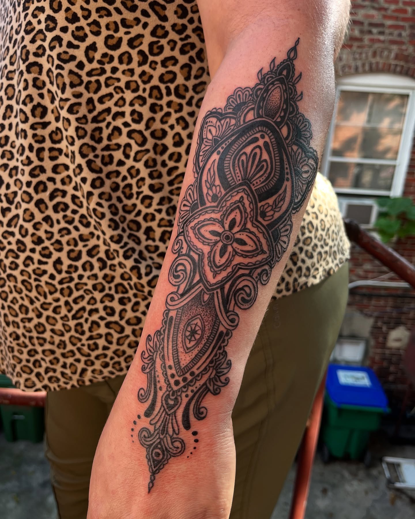Paisley black and grey tattoo on the forearm by layne