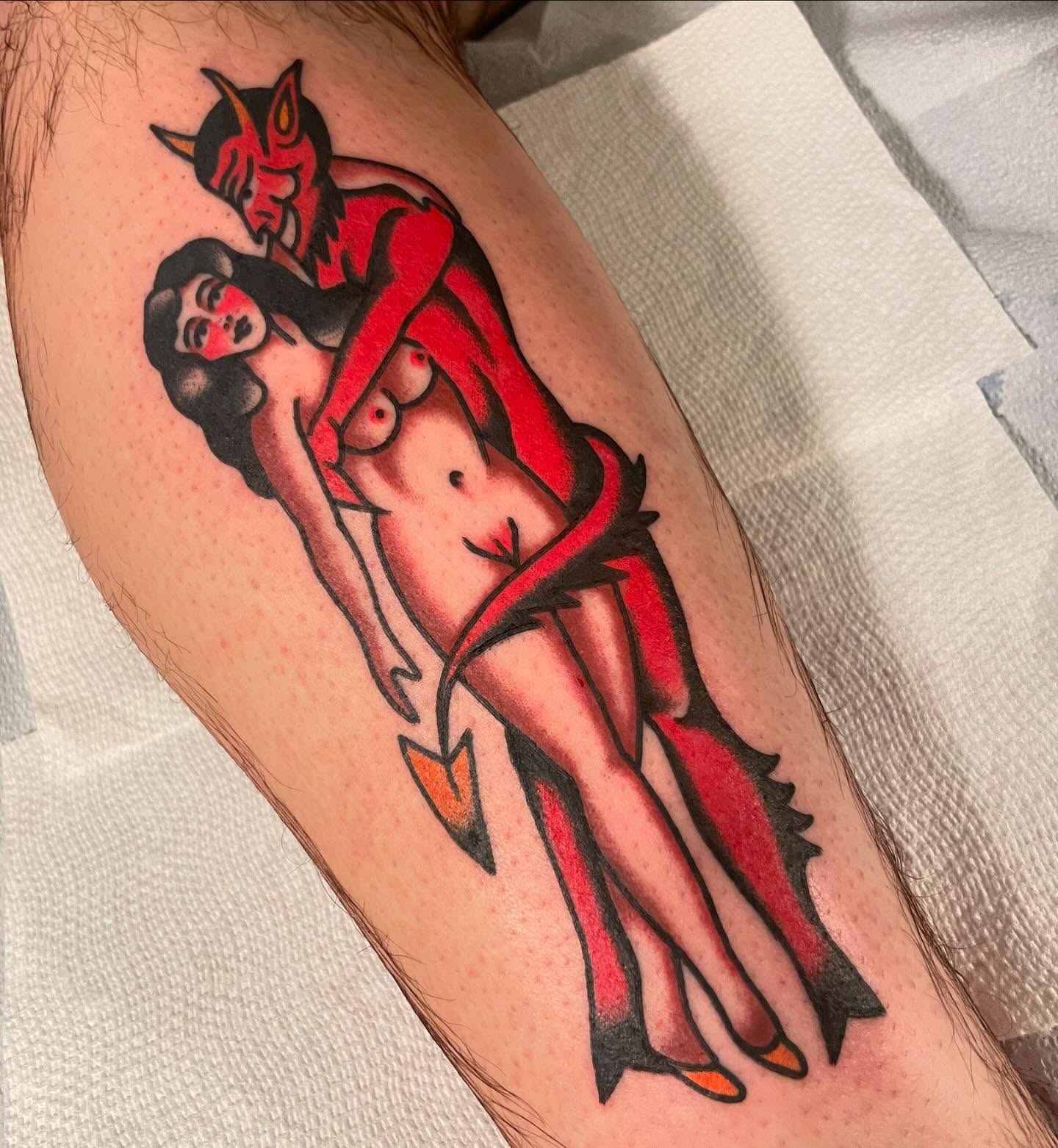 Devils American traditional tattoo on the forearm by Mike Hudgins